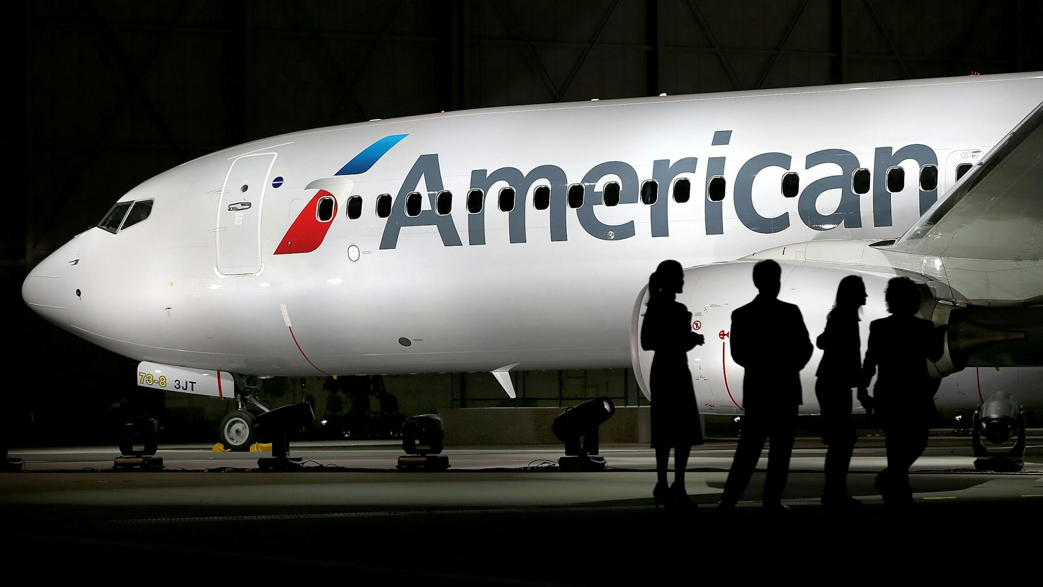 DALLAS, TX - JANUARY 17: American Airlines unveils a new company logo and exterior paint scheme on a Boeing 737-800 aircraft on January 17, 2013 in Dallas, Texas. The exterior changes are the first for the company since 1968 and were announced as the parent company of American Airlines, AMR, is considering a merger with US Airways.