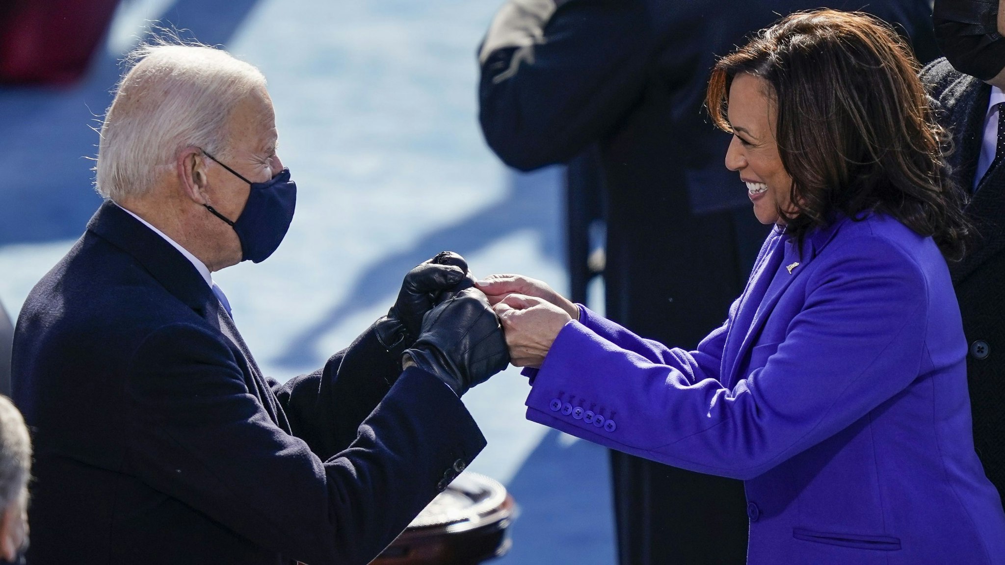 WASHINGTON, DC - JANUARY 20: U.S. President-elect Joe Biden fist bumps newly sworn-in Vice President Kamala Harris after she took the oath of office on the West Front of the U.S. Capitol on January 20, 2021 in Washington, DC. Biden was sworn in today as the 46th president of the United States.