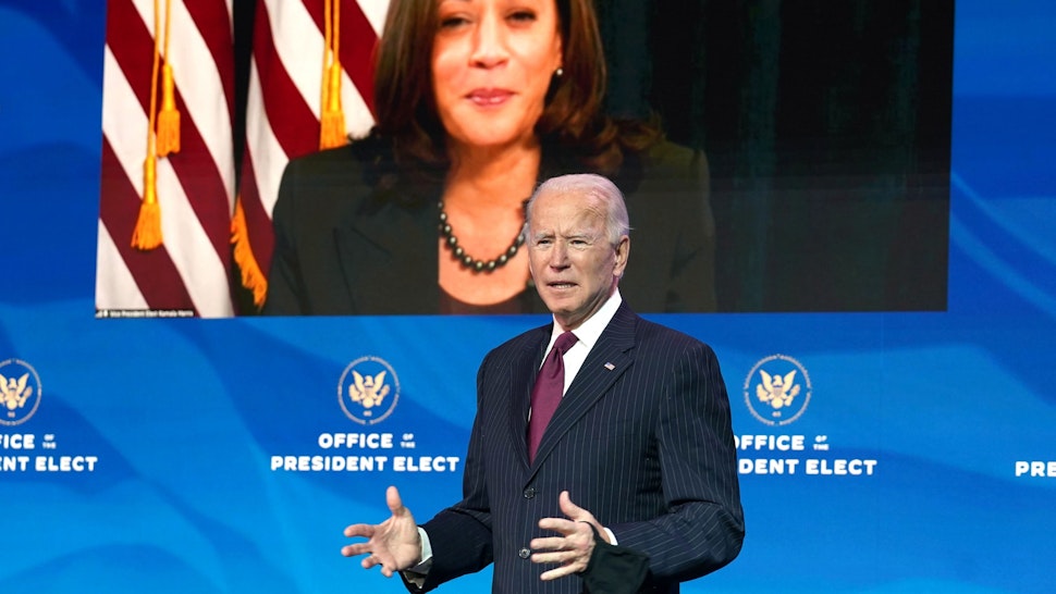 WILMINGTON, DELAWARE - DECEMBER 16: Vice President-elect Kamala Harris, appearing via video link, listens as U.S. President-elect Joe Biden speaks during a news conference at his transition headquarters on December 16, 2020 in Wilmington, Delaware. Biden made further announcements regarding his administration's cabinet choices including nominating former Democratic presidential candidate Pete Buttigieg to be Transportation Secretary.