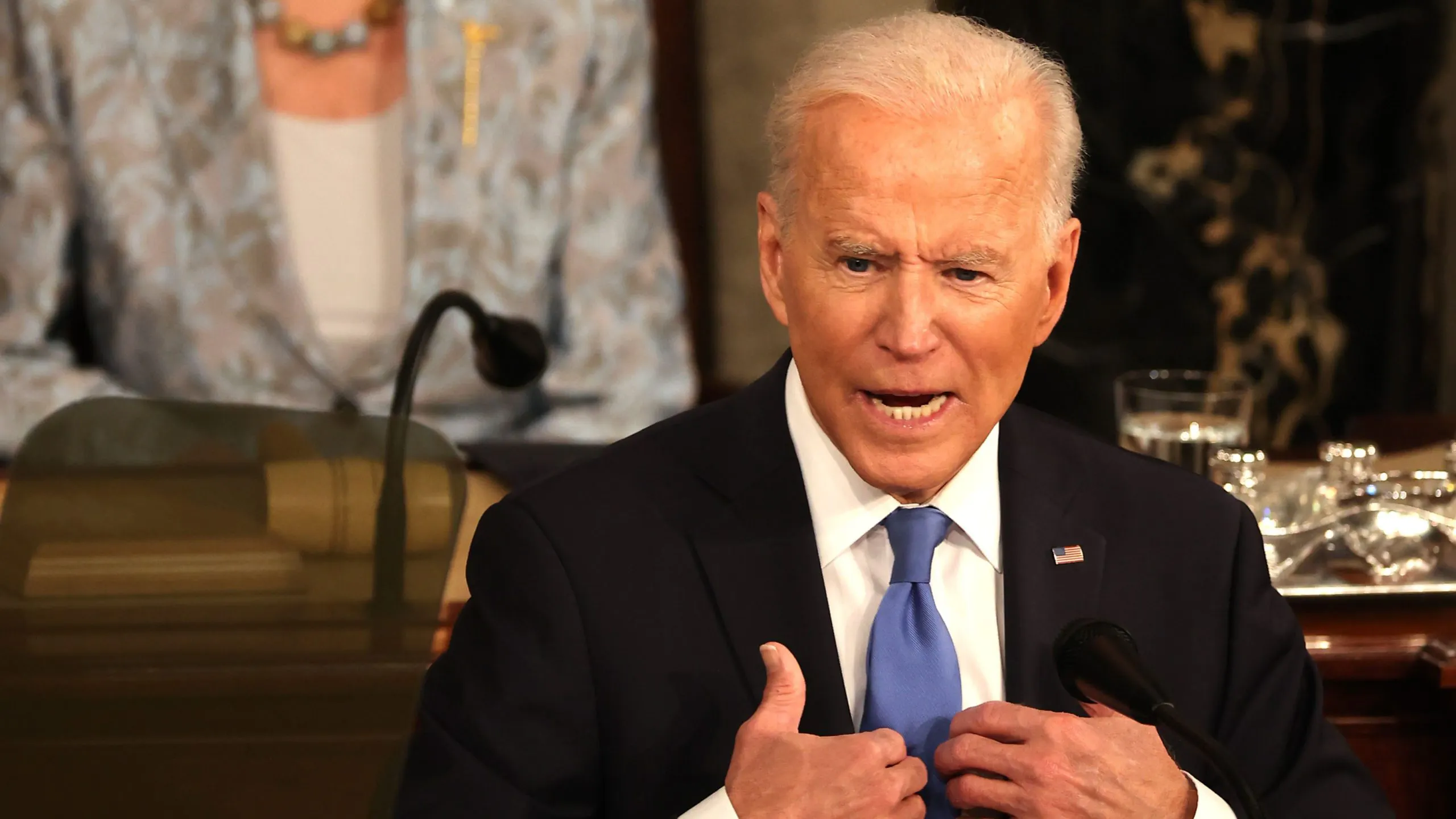 WASHINGTON, DC - APRIL 28: U.S. President Joe Biden addresses a joint session of congress as Speaker of the House U.S. Rep. Nancy Pelosi (D-CA) (L) looks on in the House chamber of the U.S. Capitol April 28, 2021 in Washington, DC. On the eve of his 100th day in office, Biden spoke about his plan to revive America’s economy and health as it continues to recover from a devastating pandemic. He delivered his speech before 200 invited lawmakers and other government officials instead of the normal 1600 guests because of the ongoing COVID-19 pandemic.