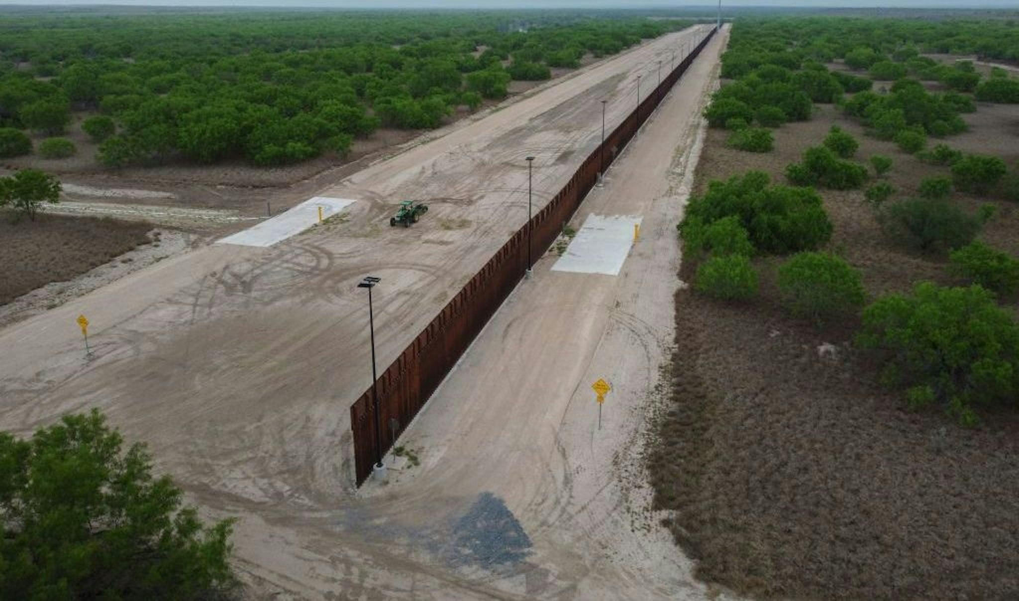A photo taken on March 30, 2021 shows a general view of an unfinished section of a border wall that former US president Donald Trump tried to build near the southern Texas border city of Roma. - The 11,000 inhabitants of the Texas border town Roma have been living with illegal immigrants for decades. Many have mixed feelings about the new arrivals: empathy and compassion on the one hand - especially since many of their family members also arrived in the United States illegally - but also concern and fear about the growing number of migrants in recent months. Sometimes 500 per night, many of them families or unaccompanied minors. (Photo by Ed JONES / AFP) (Photo by ED JONES/AFP via Getty Images)