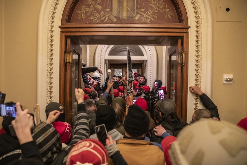 Demonstrators walk through the U.S. Capitol after breaching barricades to the building during a protest outside of in Washington, D.C., U.S., on Wednesday, Jan. 6, 2021. The U.S. Capitol was placed under lockdown and Vice President Mike Pence left the floor of Congress as hundreds of protesters swarmed past barricades surrounding the building where lawmakers were debating Joe Biden's victory in the Electoral College.