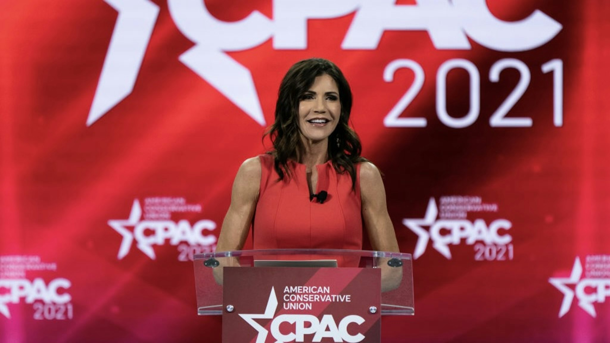 Kristi Noem, governor of South Dakota, speaks during the Conservative Political Action Conference (CPAC) in Orlando, Florida, U.S., on Saturday, Feb. 27, 2021. Donald Trump will speak at the annual Conservative Political Action Campaign conference in Florida, his first public appearance since leaving the White House, to an audience of mostly loyal followers. Photographer: Elijah Nouvelage/Bloomberg