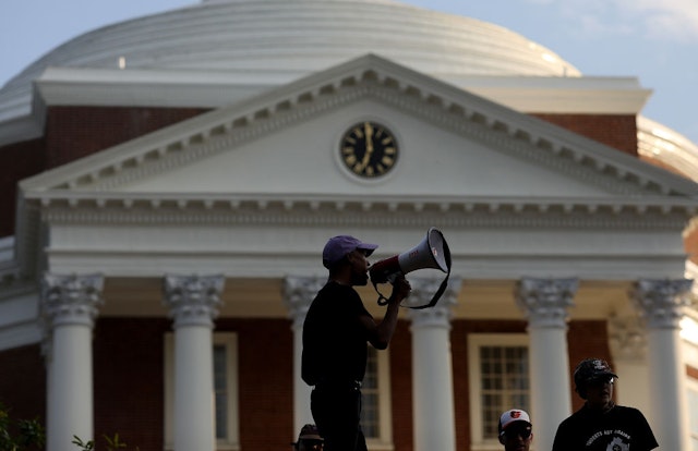 CHARLOTTESVILLE, VA - AUGUST 11: Protesters with the group Students Act Against White Supremacy speak on the campus of the University of Virginia during an event marking the one year anniversary of a deadly clash between white supremacists and counter protesters August 11, 2018 in Charlottesville, Virginia. Charlottesville has been declared in a state of emergency by Virginia Gov. Ralph Northam as the city braces for the one year anniversary of the deadly clash between white supremacist forces and counter protesters over the potential removal of Confederate statues of Robert E. Lee and Stonewall Jackson. A ÒUnite the RightÓ rally featuring some of the same groups is planned for tomorrow in Washington, DC. (Photo by Win McNamee/Getty Images)
