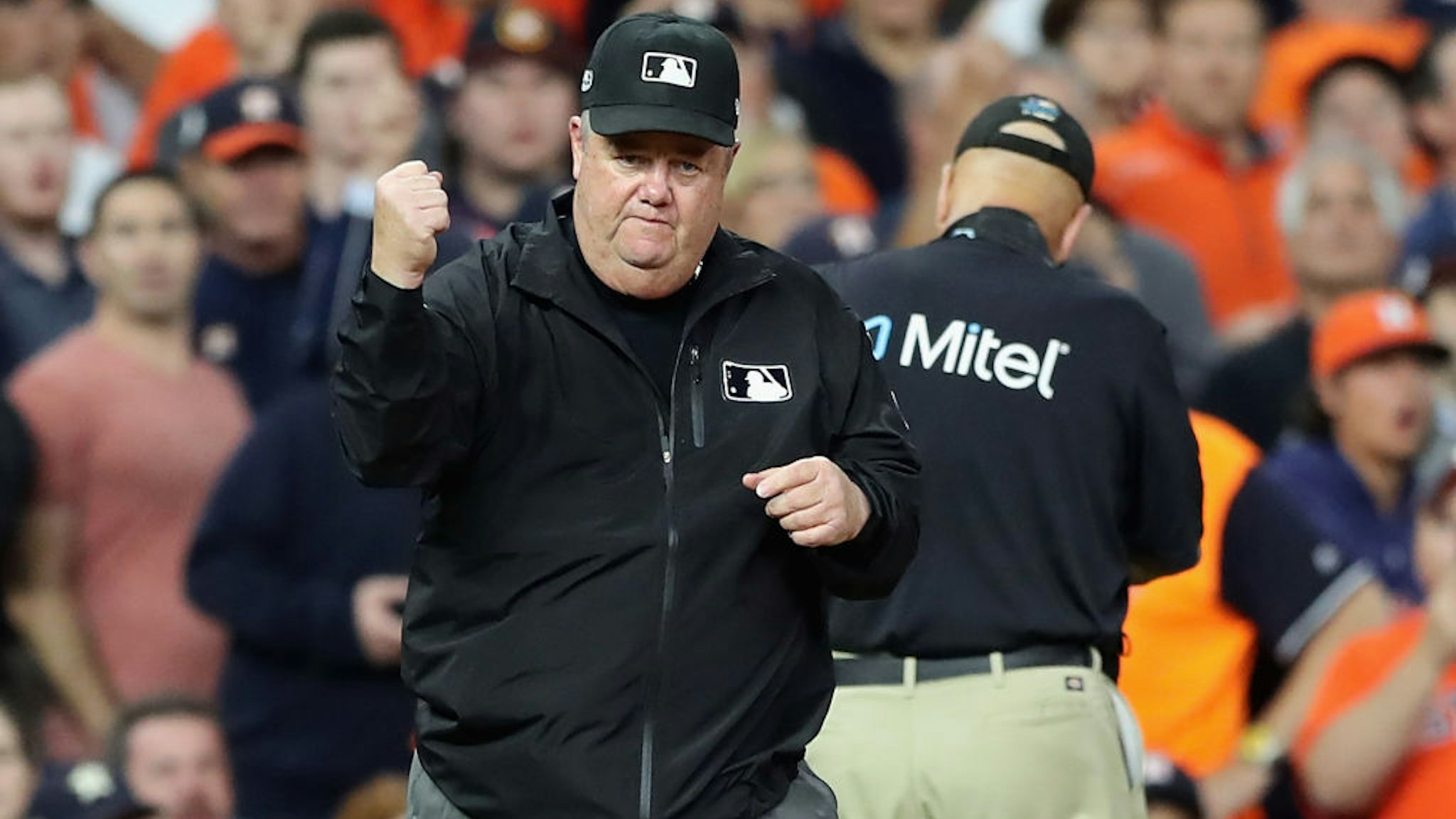 HOUSTON, TX - OCTOBER 17: Umpire Joe West calls out Jose Altuve #27 of the Houston Astros (not pictured) on fan interference in the first inning during Game Four of the American League Championship Series between the Boston Red Sox and the Houston Astros at Minute Maid Park on October 17, 2018 in Houston, Texas. (Photo by Elsa/Getty Images)