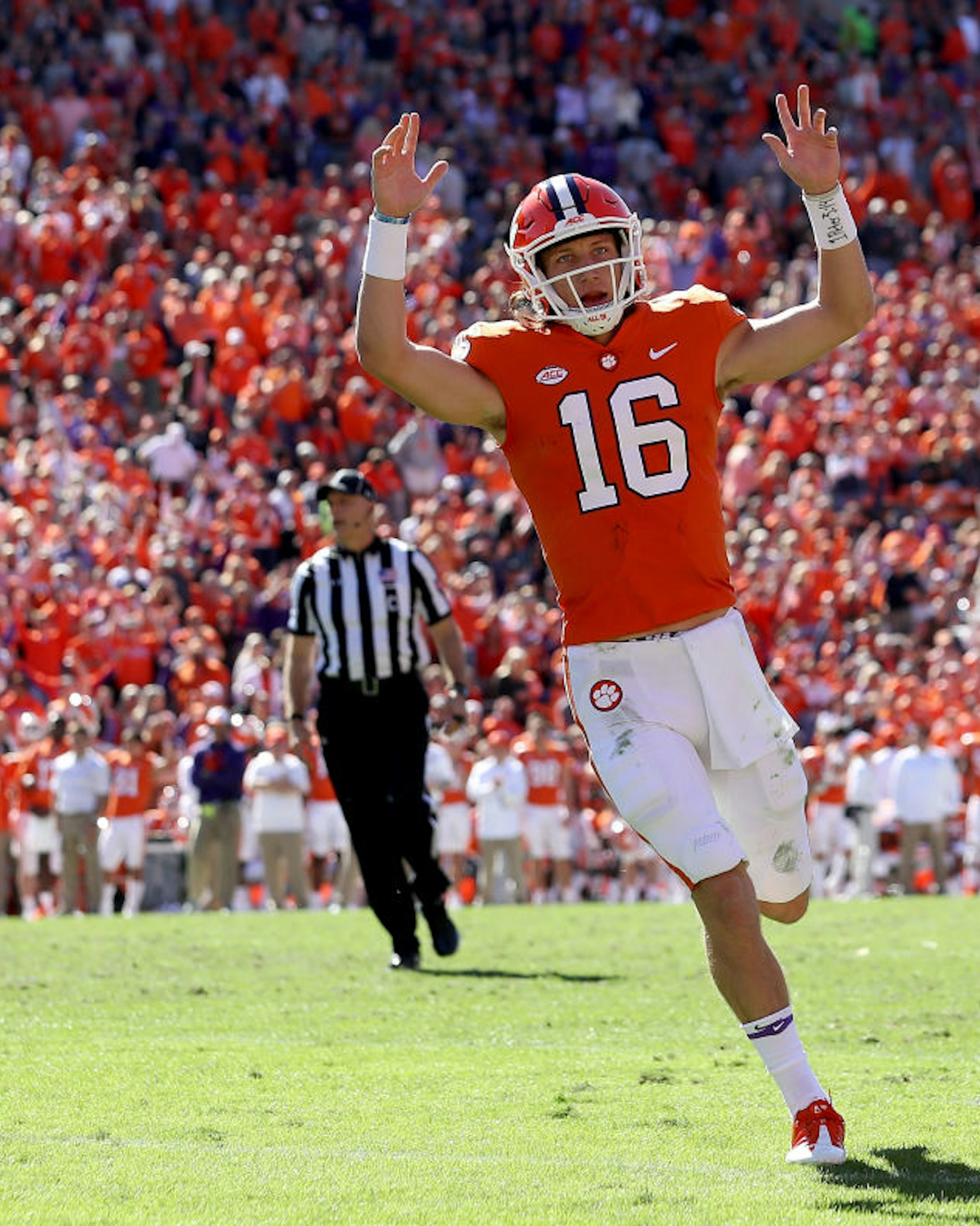 CLEMSON, SC - NOVEMBER 03: Trevor Lawrence #16 of the Clemson Tigers reacts after throwing a touchdown pass against the Louisville Cardinals during their game at Clemson Memorial Stadium on November 3, 2018 in Clemson, South Carolina. (Photo by Streeter Lecka/Getty Images)