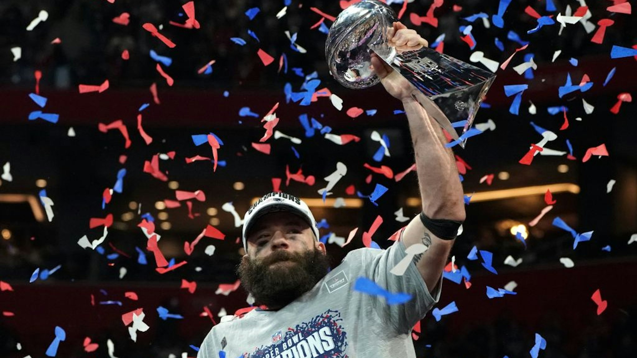 TOPSHOT - Wide receiver for the New England Patriots Julian Edelman holds the trophy as he celebrates Super Bowl LIII against the Los Angeles Rams at Mercedes-Benz Stadium in Atlanta, Georgia, on February 3, 2019. (Photo by TIMOTHY A. CLARY / AFP) (Photo credit should read TIMOTHY A. CLARY/AFP via Getty Images)