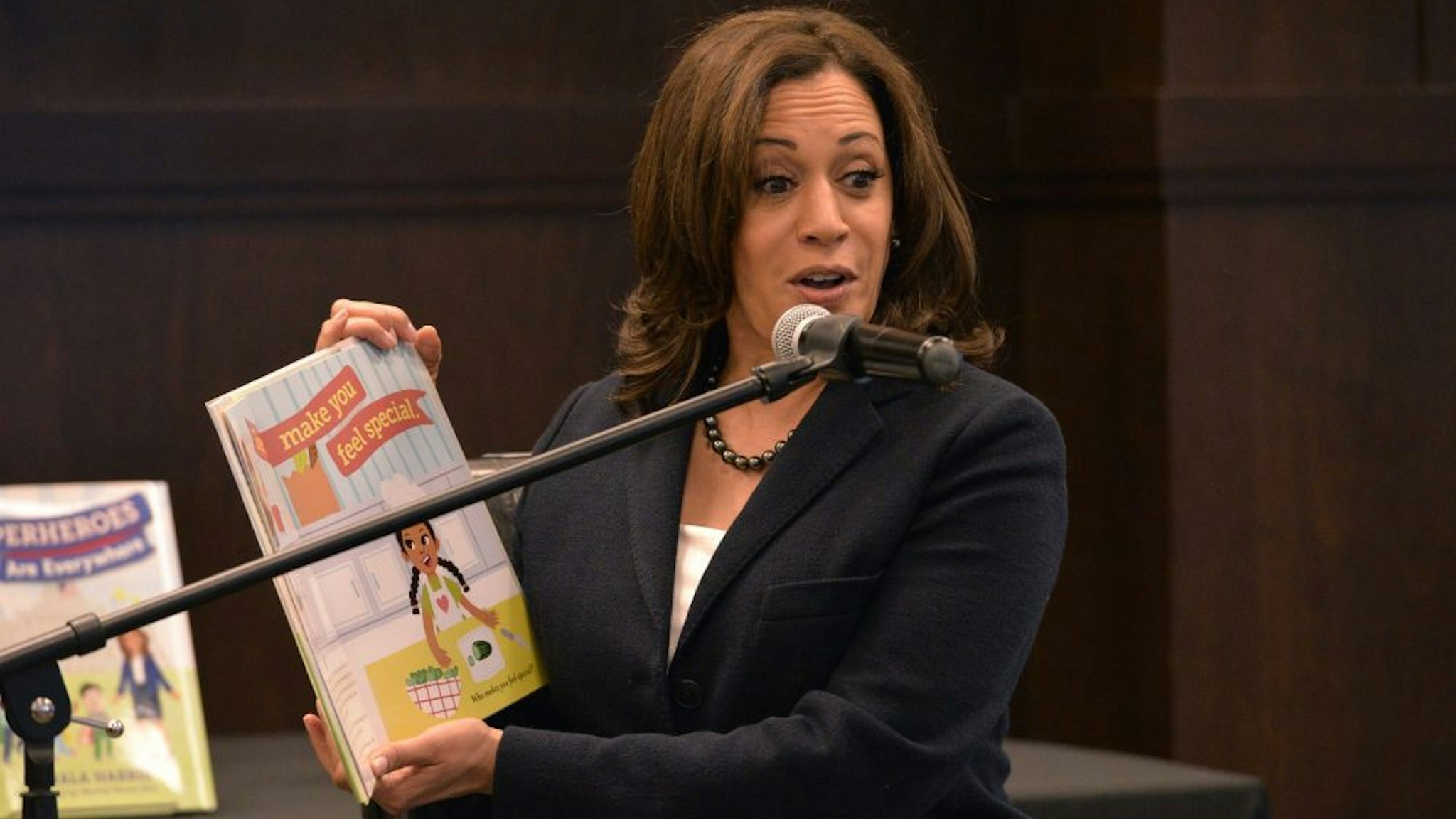 LOS ANGELES, CALIFORNIA - JANUARY 13: California Senator Kamala Harris reads to her audience at a signing event for her childrens book "Superheros Are Everywhere" at Barnes &amp; Noble at The Grove on January 13, 2019 in Los Angeles, California.