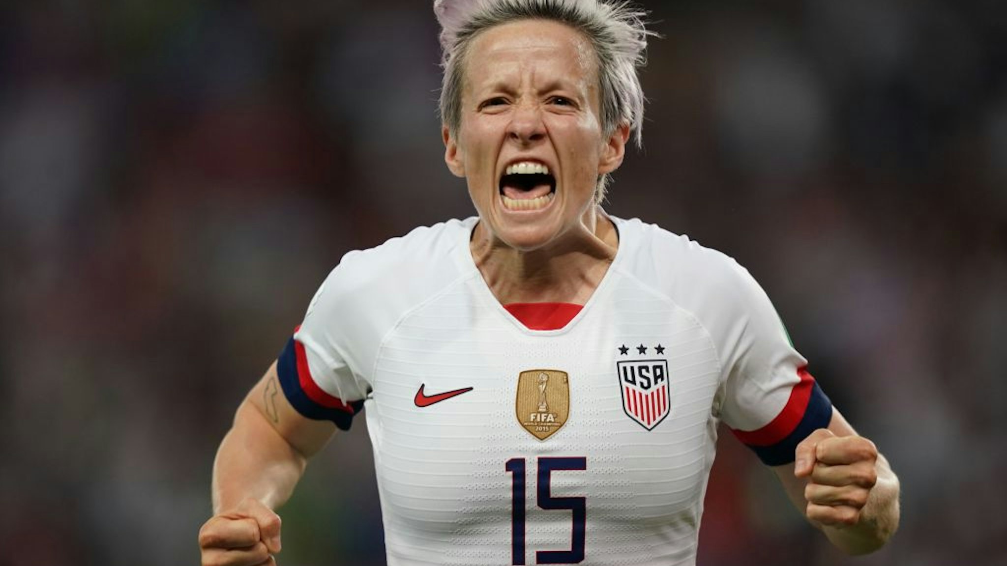 TOPSHOT - United States' forward Megan Rapinoe celebrates after scoring a goal during the France 2019 Women's World Cup quarter-final football match between France and USA, on June 28, 2019, at the Parc des Princes stadium in Paris. (Photo by Lionel BONAVENTURE / AFP) (Photo credit should read LIONEL BONAVENTURE/AFP via Getty Images)