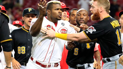 Pittsburgh Pirates v Cincinnati Reds CINCINNATI, OHIO - JULY 30: Yasiel Puig #66 of the Cincinnati Reds is restrained during a bench clearing altercation in the 9th inning of the game against the Pittsburgh Pirates at Great American Ball Park on July 30, 2019 in Cincinnati, Ohio. (Photo by Andy Lyons/Getty Images)