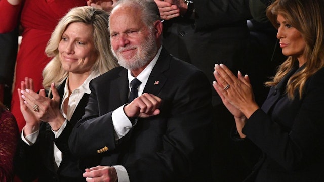 Radio personality Rush Limbaugh pumps his fist as he is acknowledged by US President Donald Trump as he delivers the State of the Union address at the US Capitol in Washington, DC, on February 4, 2020. (Photo by MANDEL NGAN / AFP) (Photo by MANDEL NGAN/AFP via Getty Images)