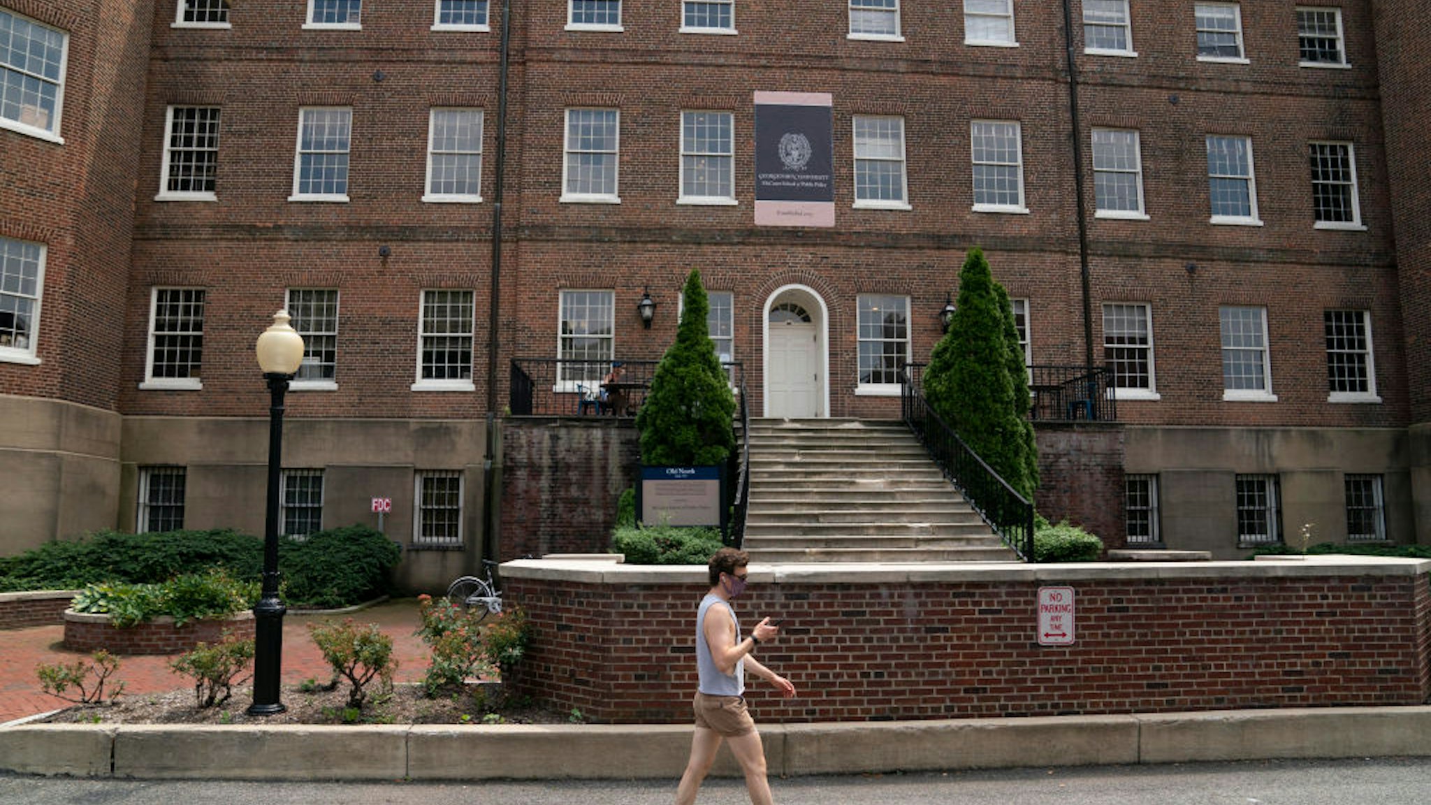 A man walks on Georgetown University's main campus in Washington, D.C., the United States, on July 7, 2020.