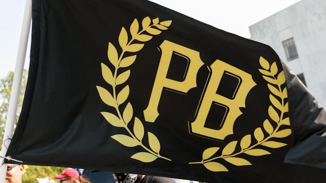 A flag of the Proud Boys, a far-right neo-fascist organization, is seen as Donald Trump supporters and heavily-armed âProud Boysâ, a far-right neo-fascist menâs group, gather for a âDonald Trump Cruise Rallyâ at Oregonâs State Capitol in Salem, Oregon, United States on September 07, 2020