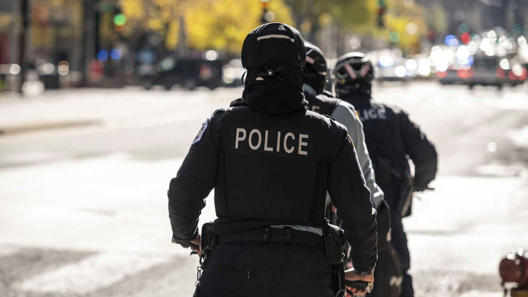Chicago police officers patrol Michigan Avenue in Chicago, Illinois, U.S., on Nov. 2, 2020. After being caught off guard during nationwide social unrest this summer and suffering millions in damages, retailers have spent months prepping for another possible bout of vandalism on Election Day. Photographer: Christopher Dilts/Bloomberg via Getty Images