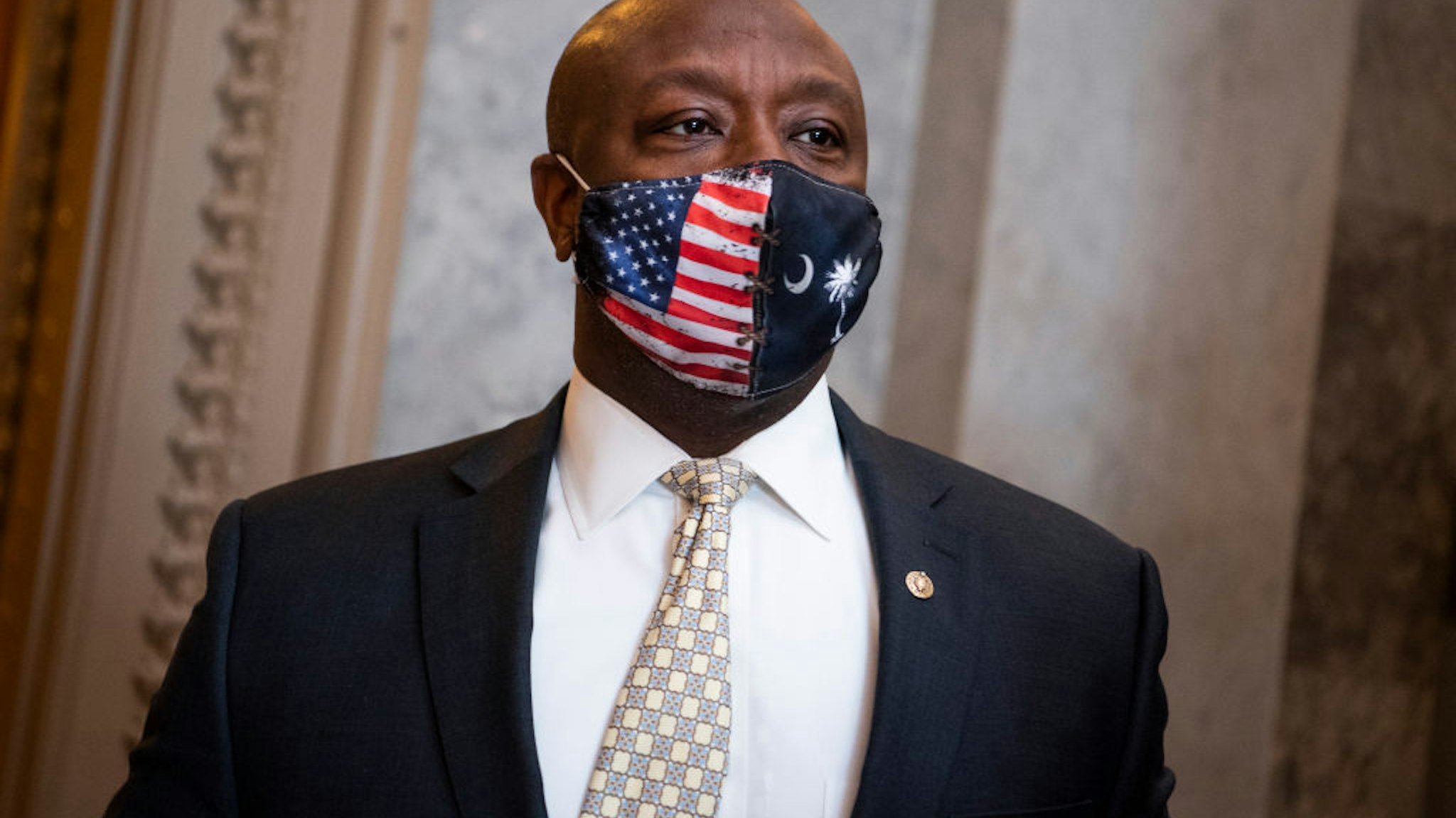 Sen. Tim Scott, R-S.C., is seen outside the chamber as the Senate votes to open debate on the coronavirus relief package on Thursday, March 4, 2021.