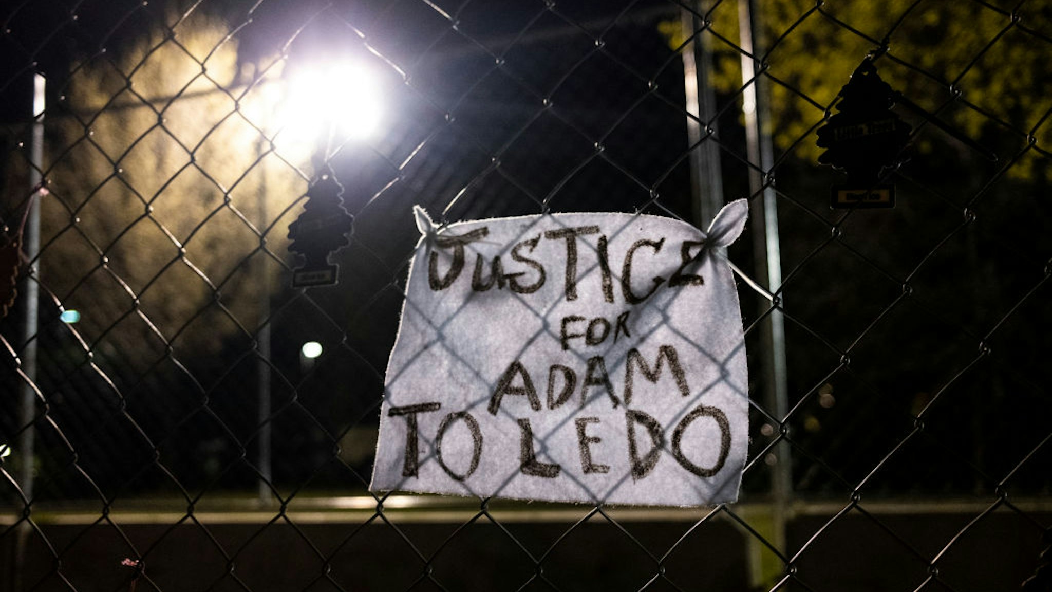 BROOKLYN CENTER, MN - APRIL 17: A piece of cloth with a note reading "Justice for Adam Toledo" is affixed to fencing outside the Brooklyn Center police station on April 17, 2021 in Brooklyn Center, Minnesota. This is the seventh day of protests in the suburban Minneapolis city following the fatal shooting of 20-year-old Daunte Wright by Brooklyn Center police officer Kimberly Potter, who has since resigned from the force and today was charged with second-degree manslaughter. (Photo by Stephen Maturen/Getty Images)