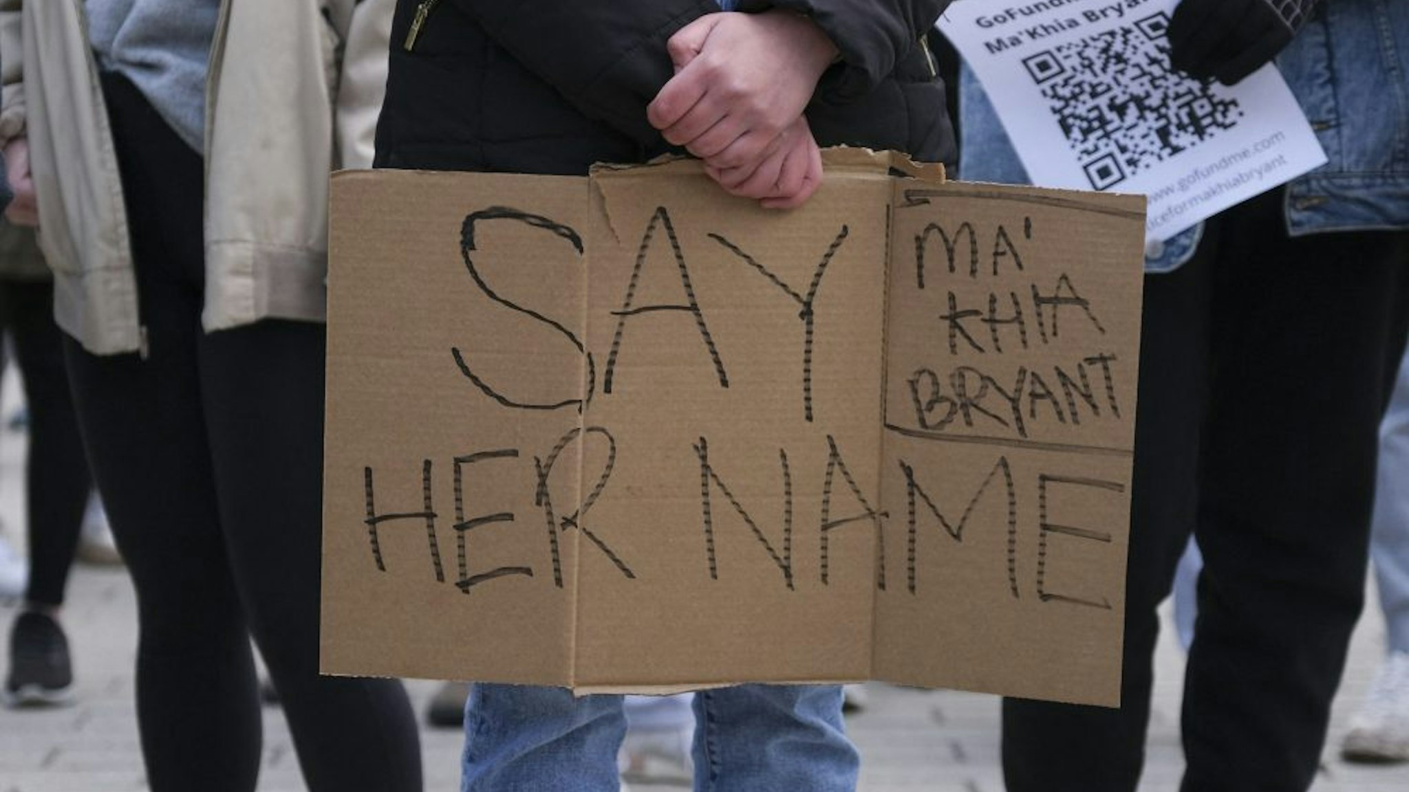 A supporter holds a sign during a staged sit-in at the Ohio Union building on the campus of The Ohio State University in Columbus, Ohio on Wednesday, April 21, 2021 to protest the killing of MaKhia Bryant, 16, by the Columbus Police Department. - Police in the US state of Ohio fatally shot a Black teenager who appeared to be lunging at another person with a knife, less than an hour before former officer Derek Chauvin was convicted of murdering George Floyd. The shooting occurred at a tense time with growing outrage against racial injustice and police brutality in the United States, and set off protests in the city of Columbus.