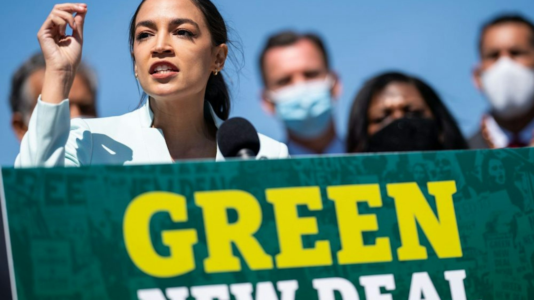 WASHINGTON, DC - APRIL 20: Rep. Alexandria Ocasio-Cortez (D-NY) speaks at a news conference to reintroduce the Green New Deal and introduce the Civilian Climate Corps Act at the Capitol Reflecting Pool near the West Front of the U.S. Capitol Building on Tuesday, April 20, 2021 in Washington, DC.