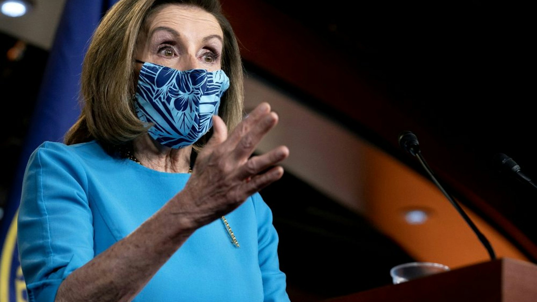U.S. House Speaker Nancy Pelosi, a Democrat from California, wears a protective mask while speaking during a news conference at the U.S. Capitol in Washington, D.C., U.S., on Thursday, April 22, 2021. Congress is moving with increasing urgency on bipartisan legislation to confront China and bolster U.S. competitiveness in technology and critical manufacturing with the Senate poised to act within weeks on a package of bills.