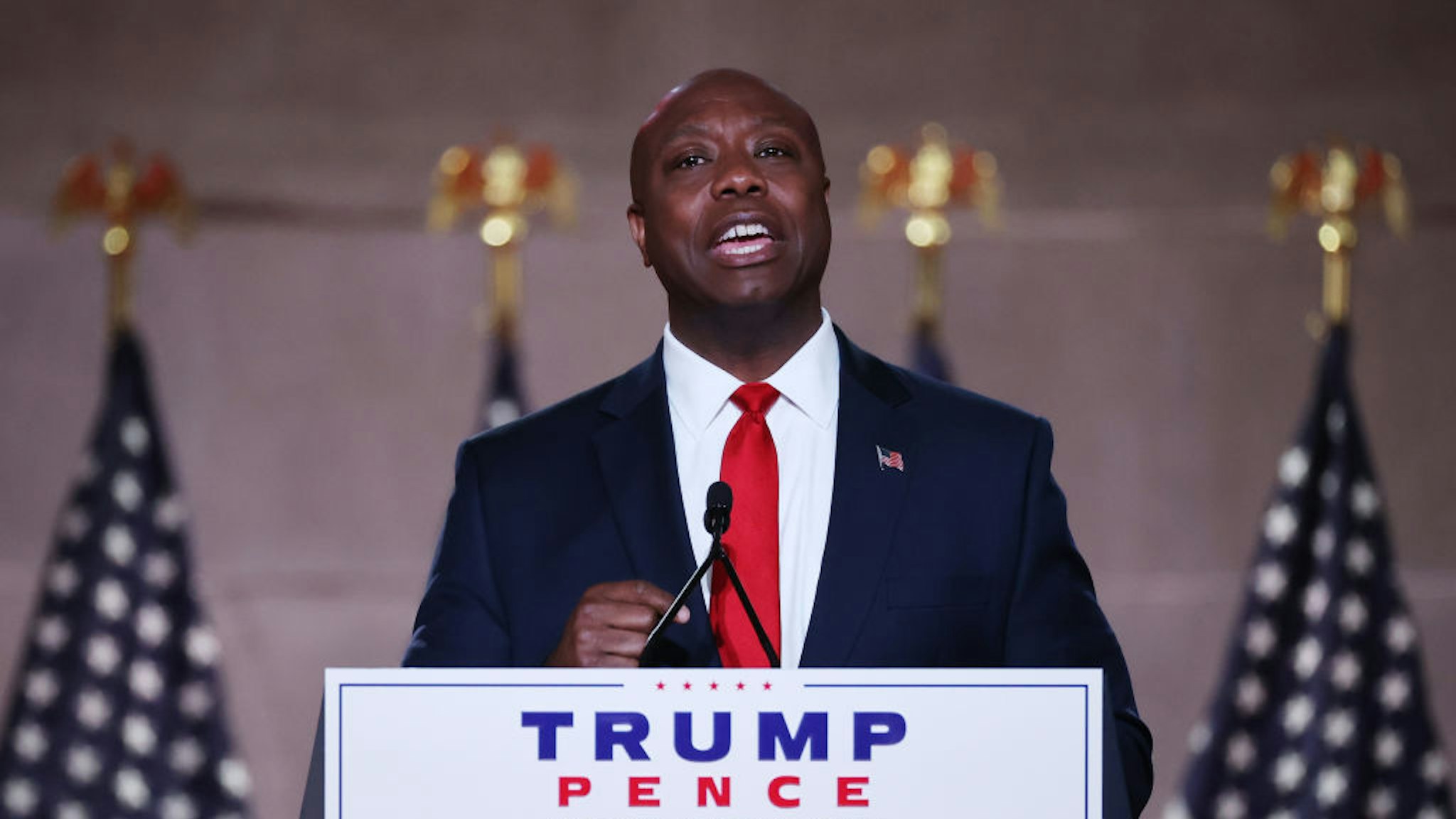WASHINGTON, DC - AUGUST 24: U.S. Sen. Tim Scott (R-SC) stands on stage in an empty Mellon Auditorium while addressing the Republican National Convention at the Mellon Auditorium on August 24, 2020 in Washington, DC. The novel coronavirus pandemic has forced the Republican Party to move away from an in-person convention to a televised format, similar to the Democratic Party's convention a week earlier.
