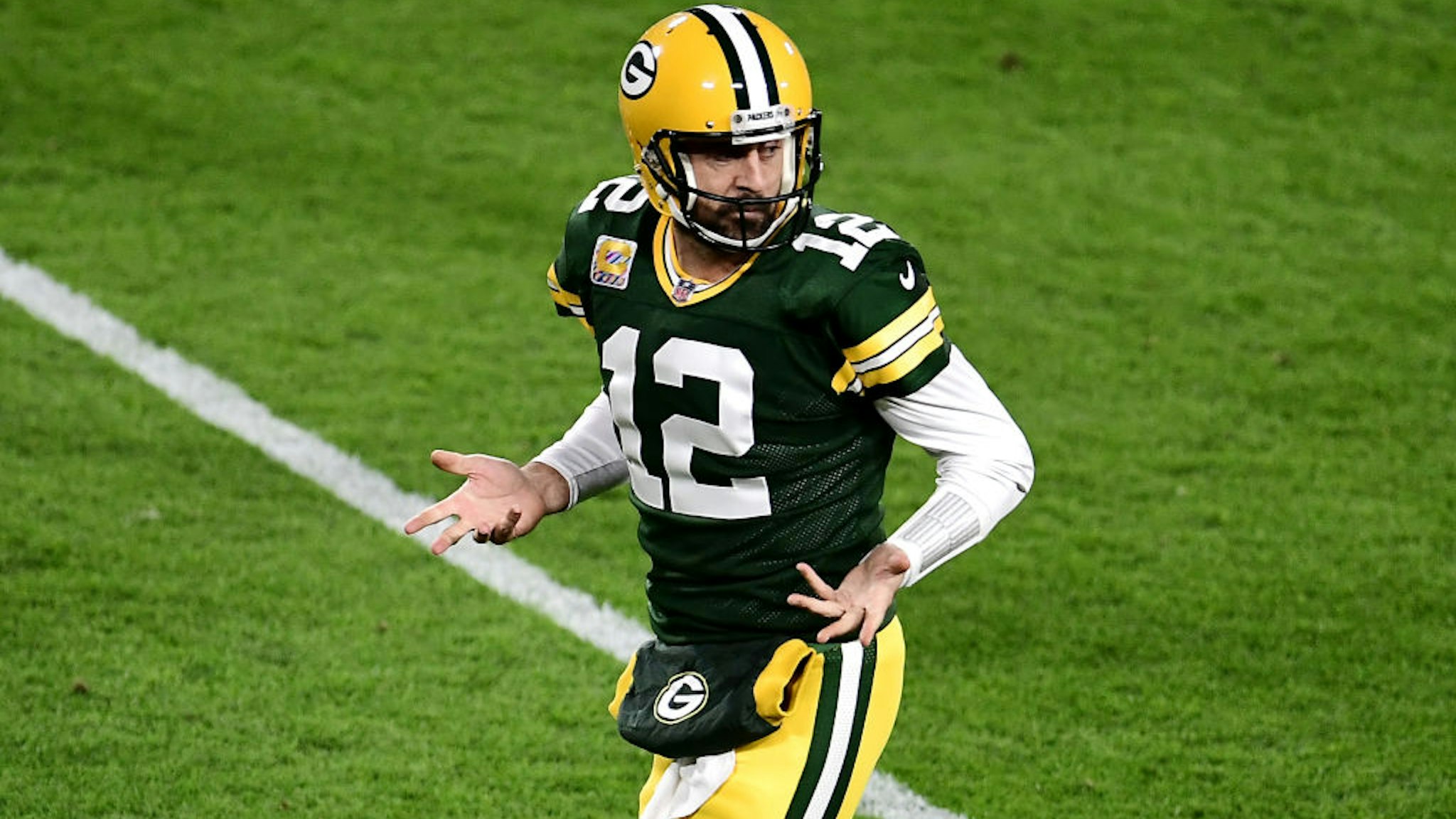 GREEN BAY, WISCONSIN - OCTOBER 05: Aaron Rodgers #12 of the Green Bay Packers reacts after throwing a touchdown pass to Robert Tonyan #85 (not pictured) during the second quarter against the Atlanta Falcons at Lambeau Field on October 05, 2020 in Green Bay, Wisconsin. (Photo by Stacy Revere/Getty Images)