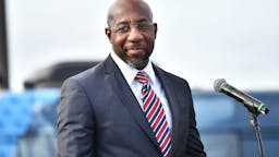 Raphael Warnock STONECREST, GEORGIA - DECEMBER 28: Georgia Democratic Senate candidate Raphael Warnock speaks onstage during the "Vote GA Blue" concert on December 28, 2020 in Stonecrest, Georgia.
