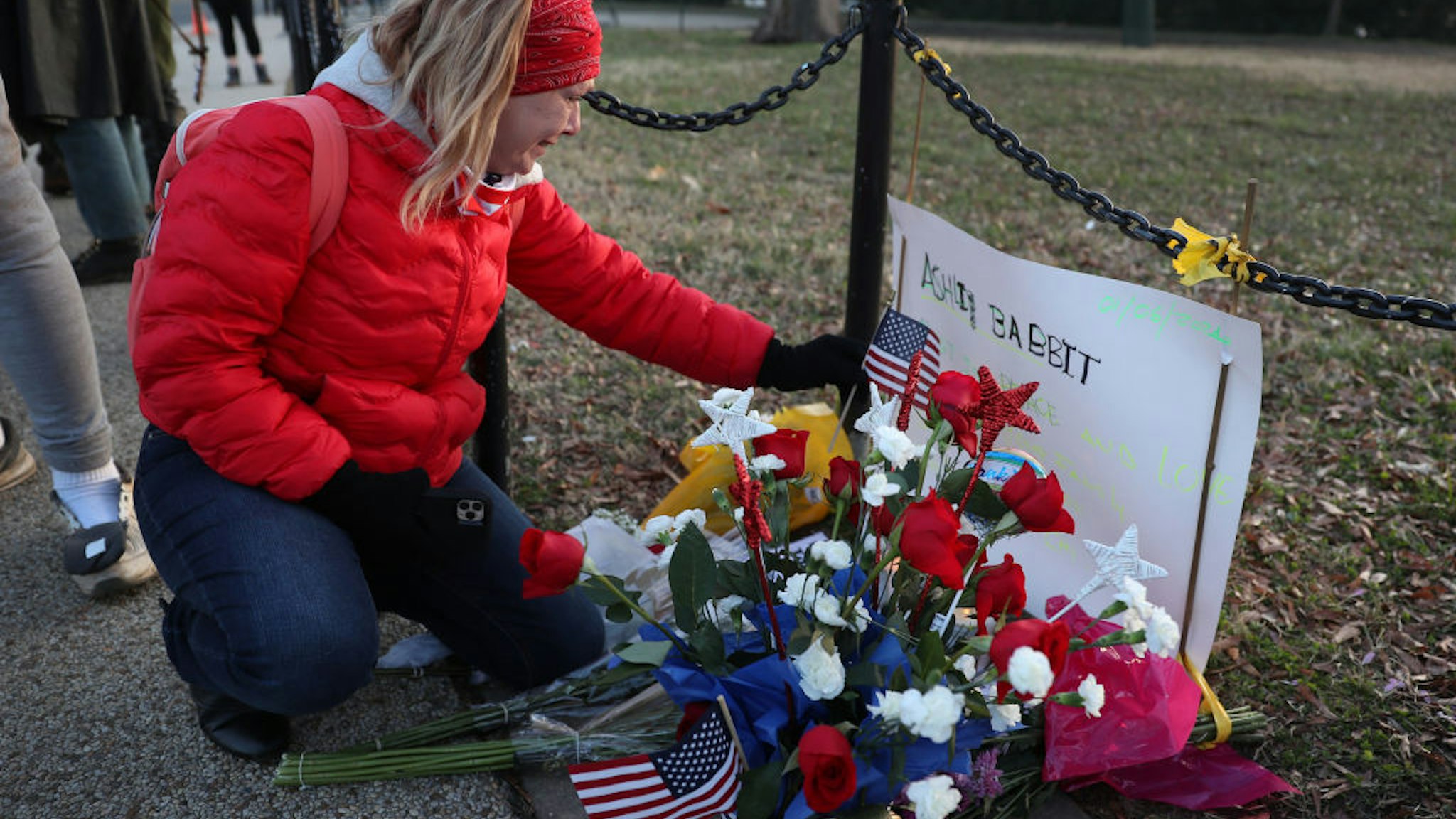 Melody Black, from Minnesota, becomes emotional as she visits a memorial setup near the U.S. Capitol Building for Ashli Babbitt who was killed in the building after a pro-Trump mob broke in on January 07, 2021 in Washington, DC.