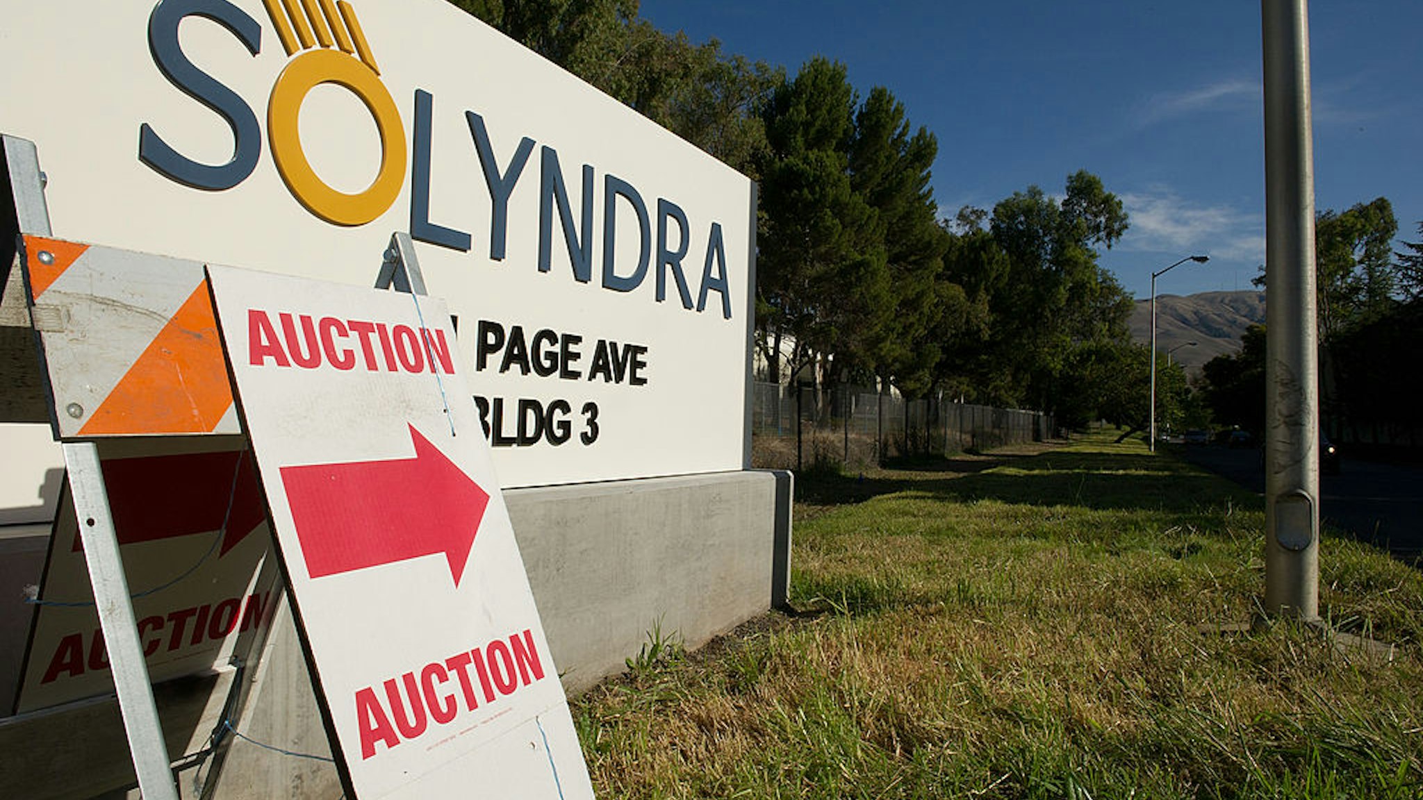 An auction sign stands at the entrance Solyndra LLC building in Fremont, California, U.S., on Wednesday, Nov. 2, 2011.