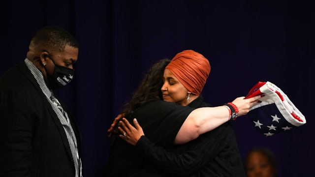 Father Aubrey Wright and mother Katie Wright are presented a flag by U.S. Rep Ilhan Omar (D-MN) during a funeral held for Daunte Wright at Shiloh Temple International Ministries on April 22, 2021 in Minneapolis, Minnesota. Daunte Wright was shot and killed by police during a traffic stop in Brooklyn Center, Minnesota on April 11 which sparked days of protests.