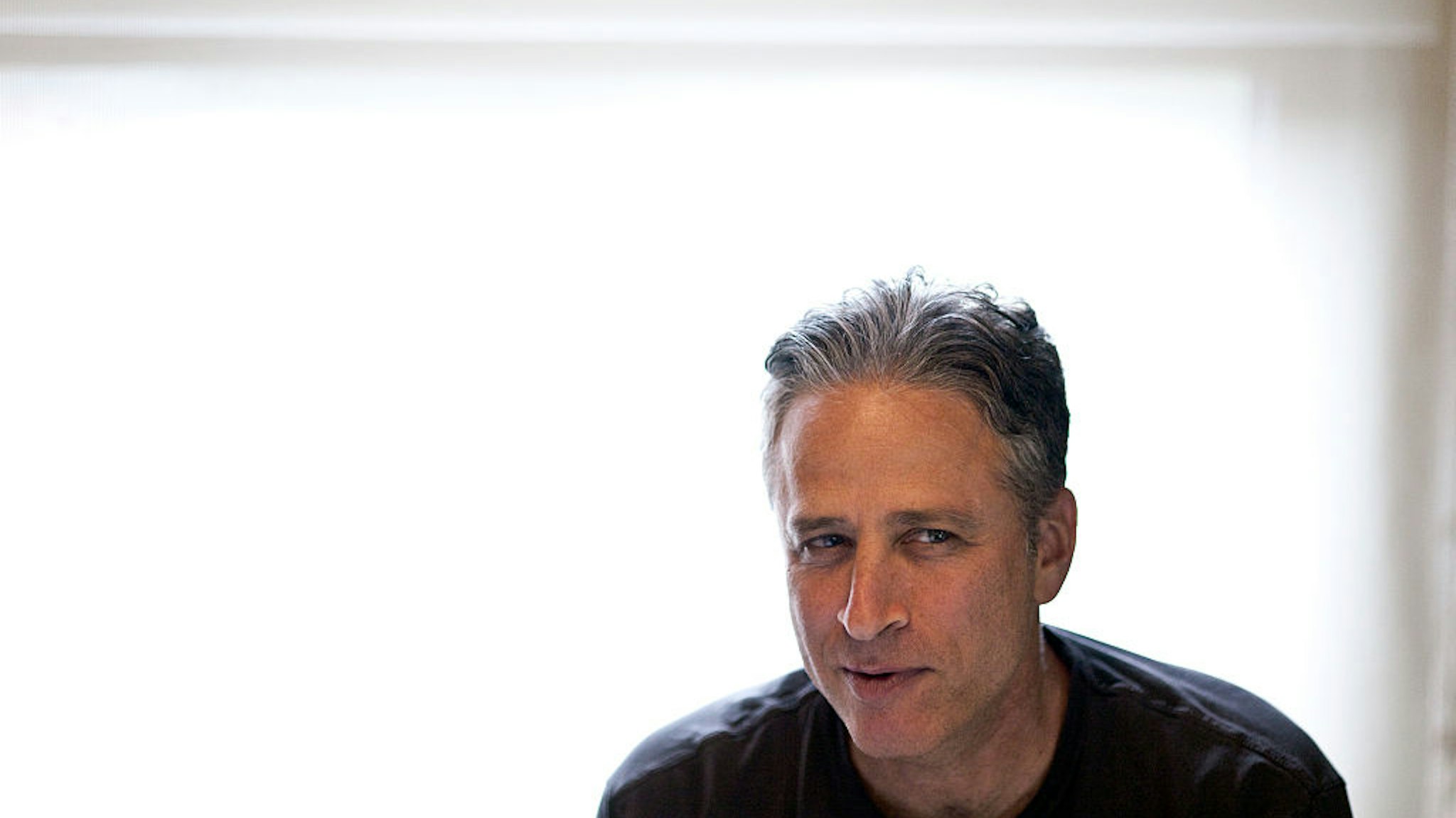 NEW YORK, NY - AUGUST 9 : Comedian Jon Stewart, host of Comedy Central's The Daily Show, works in his office on August 9, 2011 in New York. (Photo by Benjamin Lowy/Getty Images)