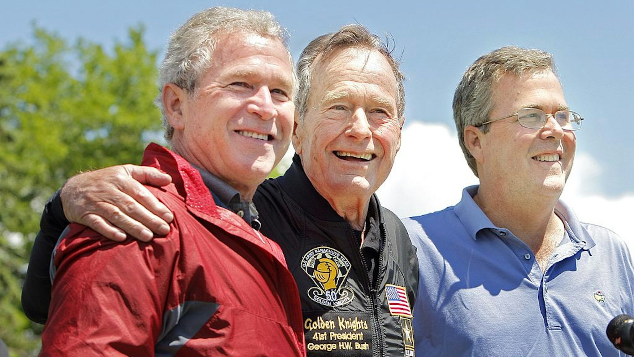 CORRECTION published Sunday, June 14, 2009: A photo cutline on Page A11 Saturday should have said former President George H. W. Bush poses with his sons former President George W. Bush and Jeb Bush. It was a photographer's error. -- Gregory Rec/Staff Photographer: -- George H.W. Bush is flanked by his sons George W. Bush and (Neil Bush)* after completing a parachute jump in Kennebunkport on Friday, June 12, 2009 for his 85th birthday. -- Correct id: JEB BUSH* (Photo by Gregory Rec/Portland Press Herald via Getty Images)