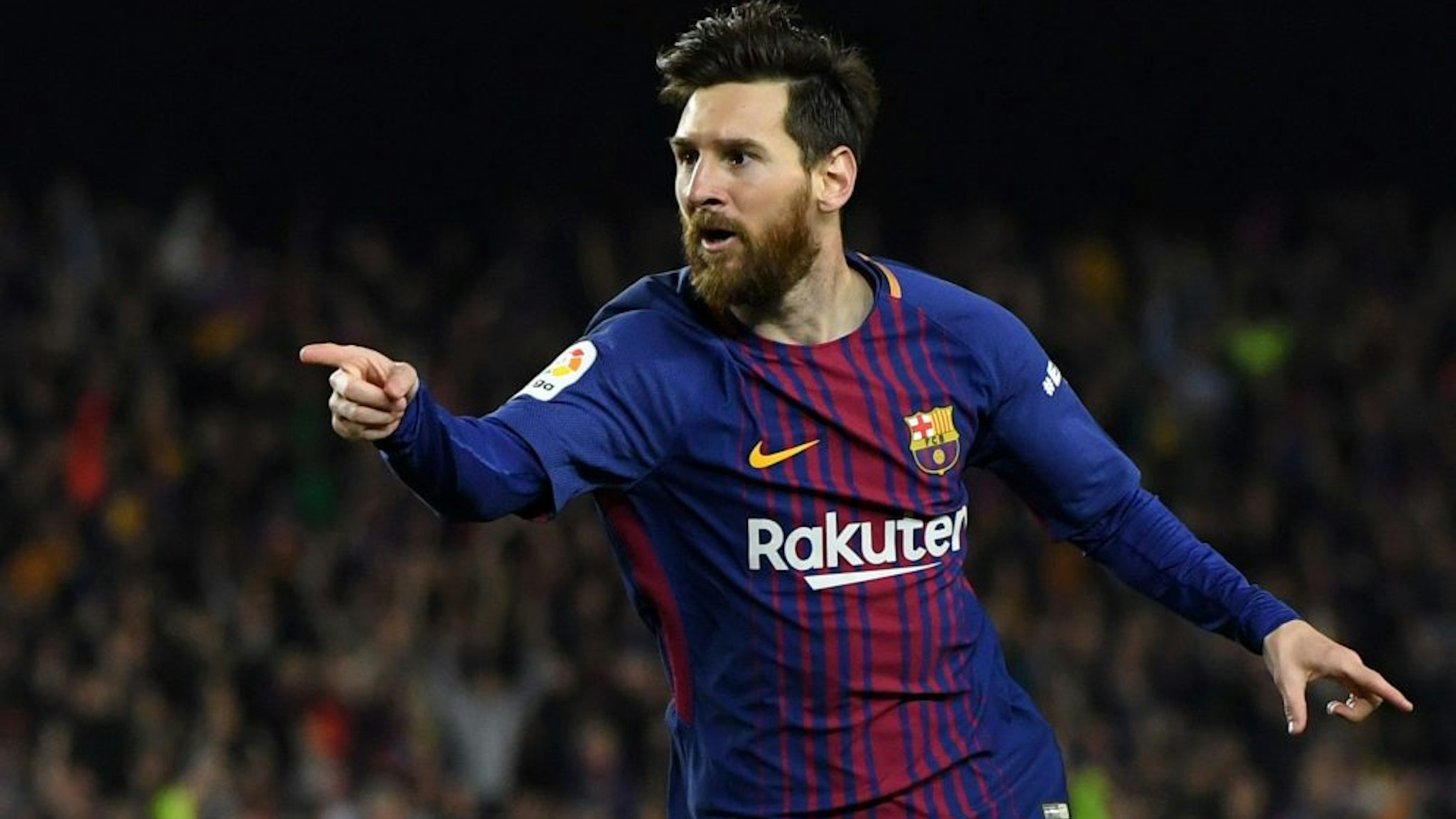 BARCELONA, SPAIN - MAY 06: Lionel Messi of Barcelona celebrates after scoring his sides second goal during the La Liga match between Barcelona and Real Madrid at Camp Nou on May 6, 2018 in Barcelona, Spain.