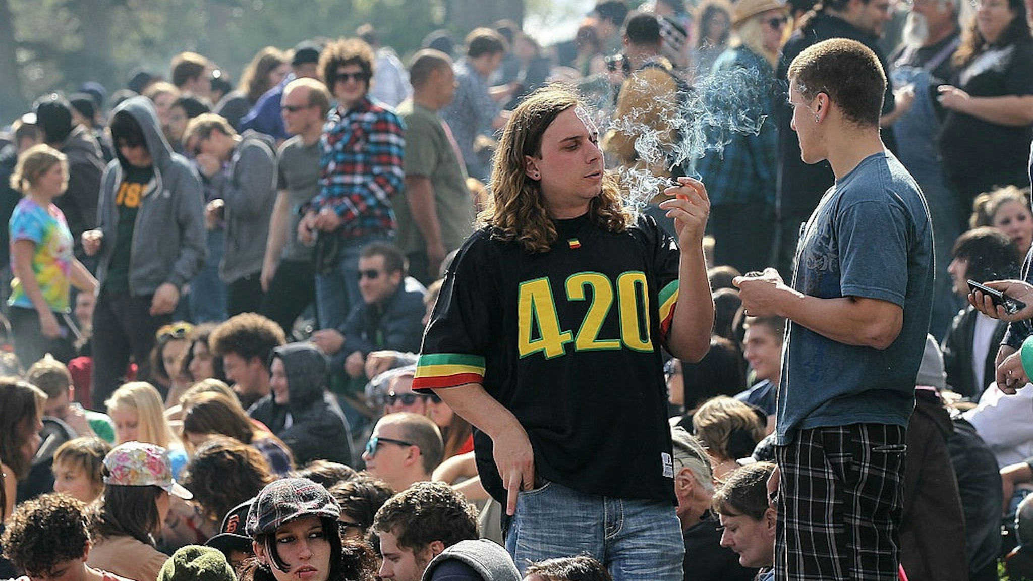 SAN FRANCISCO - APRIL 20: A marijuana user smokes marijuana during a 420 Day celebration on "Hippie Hill" in Golden Gate Park April 20, 2010 in San Francisco, California.