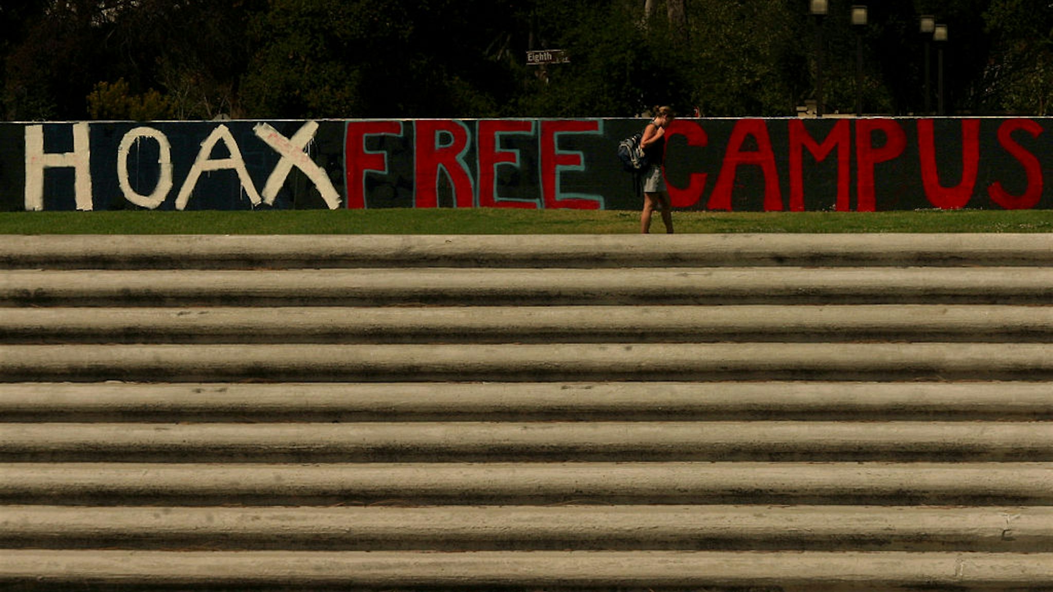 The word hoax was painted over the word hate in the phrase "we support hate free campuses" after news surfaced that Kerri Dunn, 39, a visiting assistant professor of psychology at Claremont McKenna College may have vandalized her own car in an attempt to put a spotlight on campus racism. She denies the allegation and has been placed on administrative leave. The wall, known as the Walker Wall, is used by students to express themselves on any subject.
