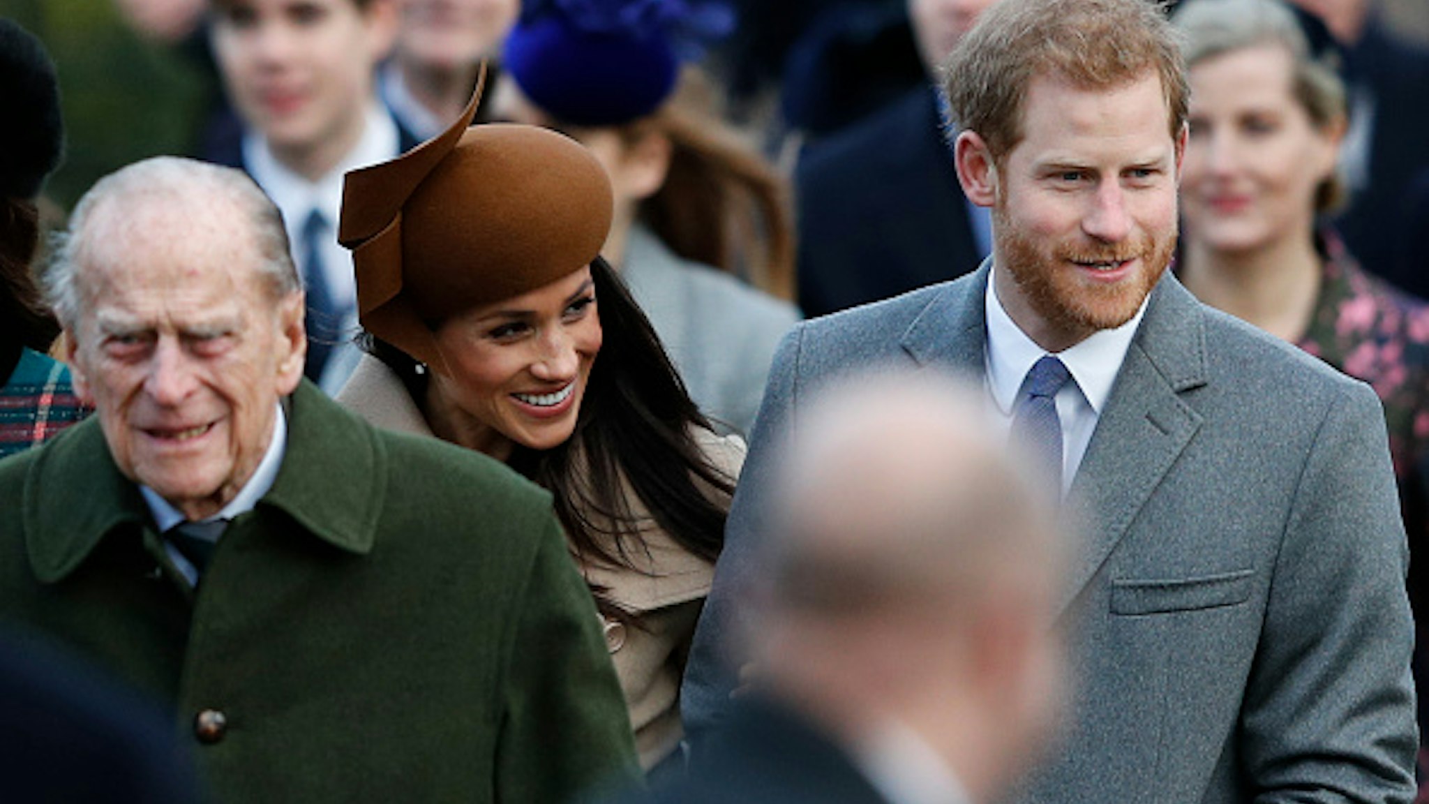 (L-R) Britain's Prince Philip, Duke of Edinburgh, US actress and fiancee of Britain's Prince Harry Meghan Markle and Britain's Prince Harry (R) arrive to attend the Royal Family's traditional Christmas Day church service at St Mary Magdalene Church in Sandringham, Norfolk, eastern England, on December 25, 2017.