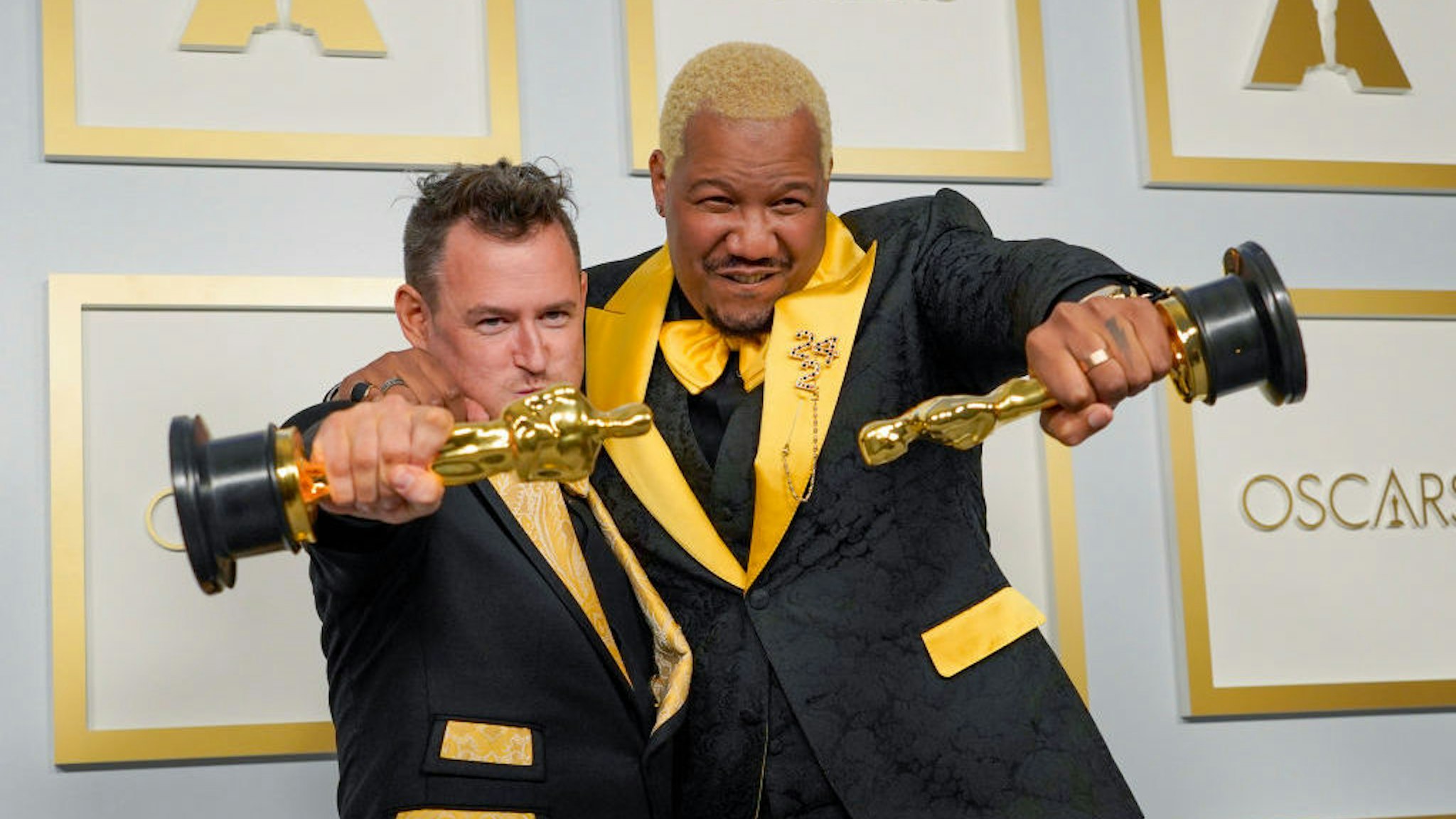 Martin Desmond Roe, left, and Travon Free, winners of the award for best live action short film for "Two Distant Strangers" pose in the press room at the Oscars on Sunday, April 25, 2021, at Union Station in Los Angeles. (AP Photo/Chris Pizzello, Pool)
