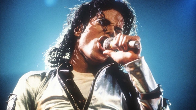 Entertainer Michael Jackson sings at a concert November 8, 1988 in California. Jackson, who was the lead singer for the Jackson Five by age eight, reached the peak of his solo career with 1982's "Thriller."