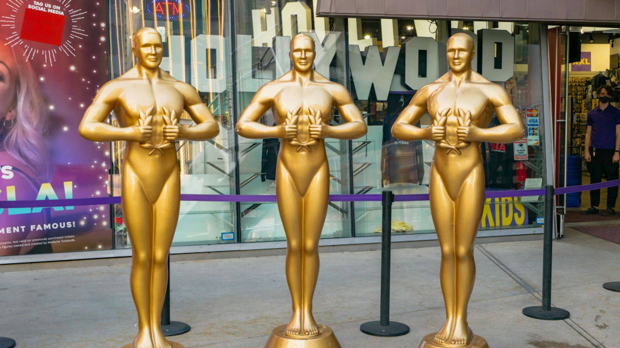 HOLLYWOOD, CA - APRIL 19: General view of Oscar-like statues on Hollywood Blvd near the Dolby Theatre at Hollywood &amp; Highland on April 19, 2021 in Hollywood, California.