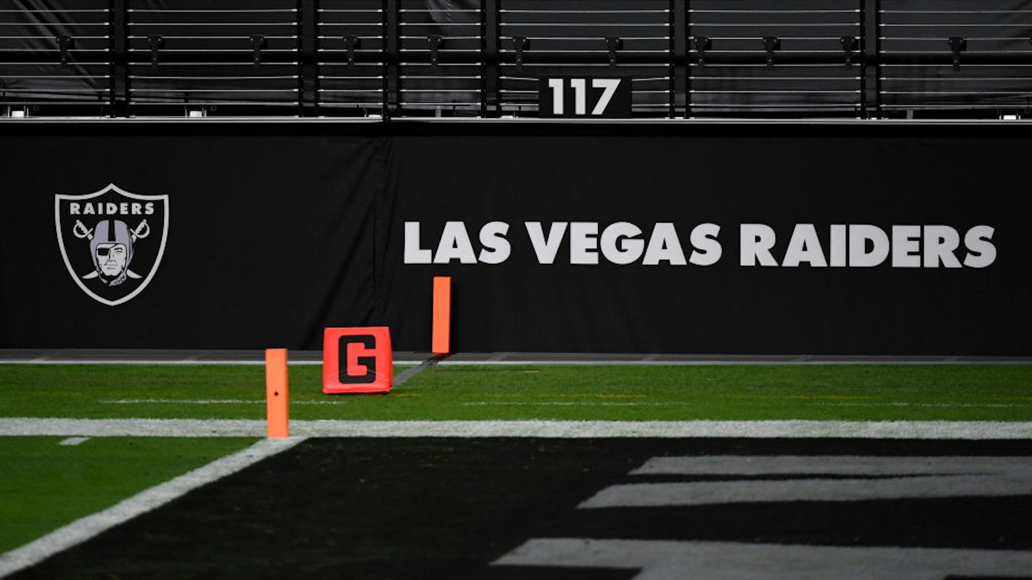 LAS VEGAS, NEVADA - DECEMBER 17: Las Vegas Raiders logos are shown on a wall before a game between the Raiders and the Los Angeles Chargers at Allegiant Stadium on December 17, 2020 in Las Vegas, Nevada. The Chargers defeated the Raiders 30-27 in overtime.