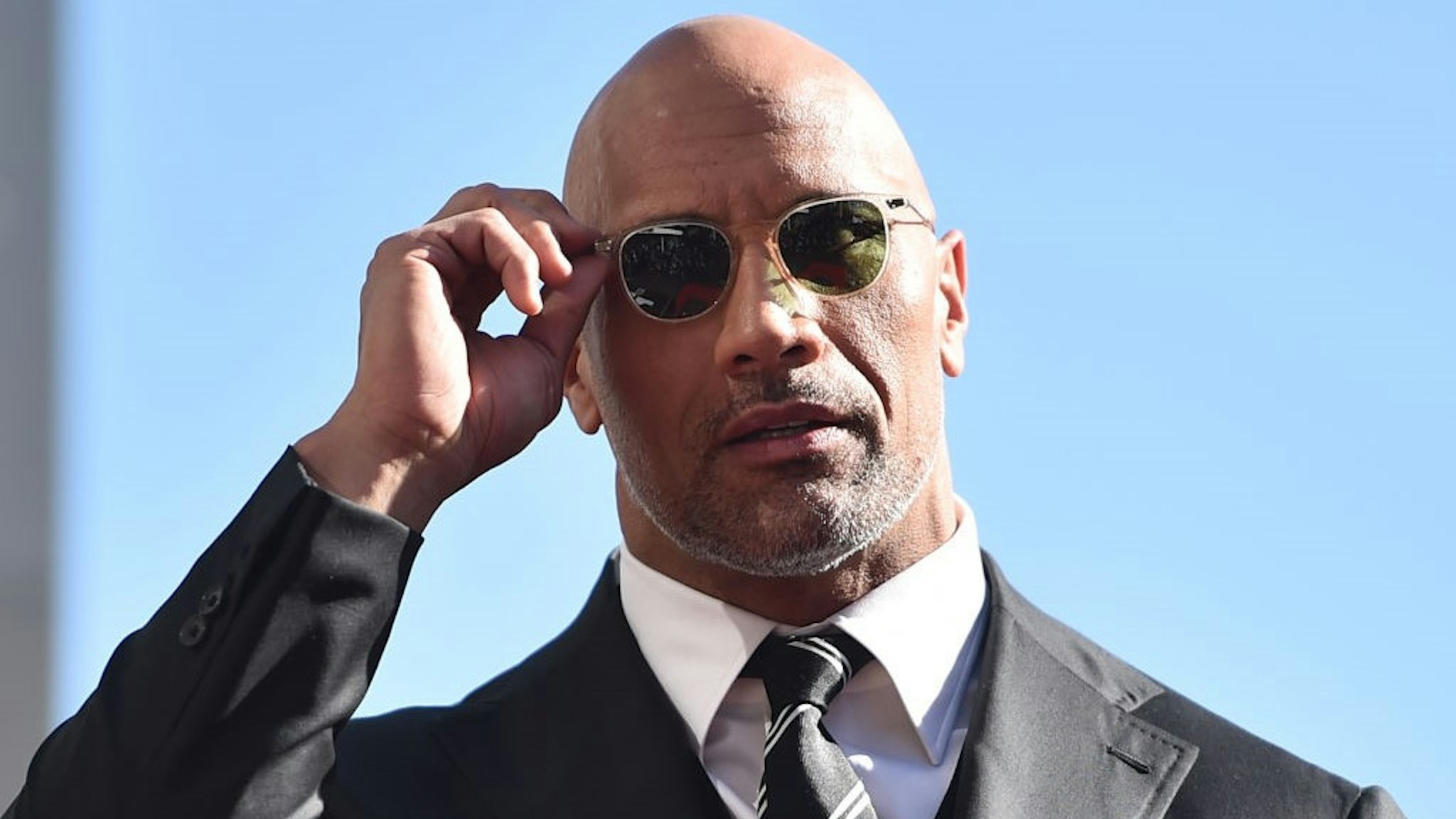 HOLLYWOOD, CA - DECEMBER 13: Actor Dwayne Johnson attends a ceremony honoring him with the 2,624th star on the Hollywood Walk of Fame on December 13, 2017 in Hollywood, California. (Photo by