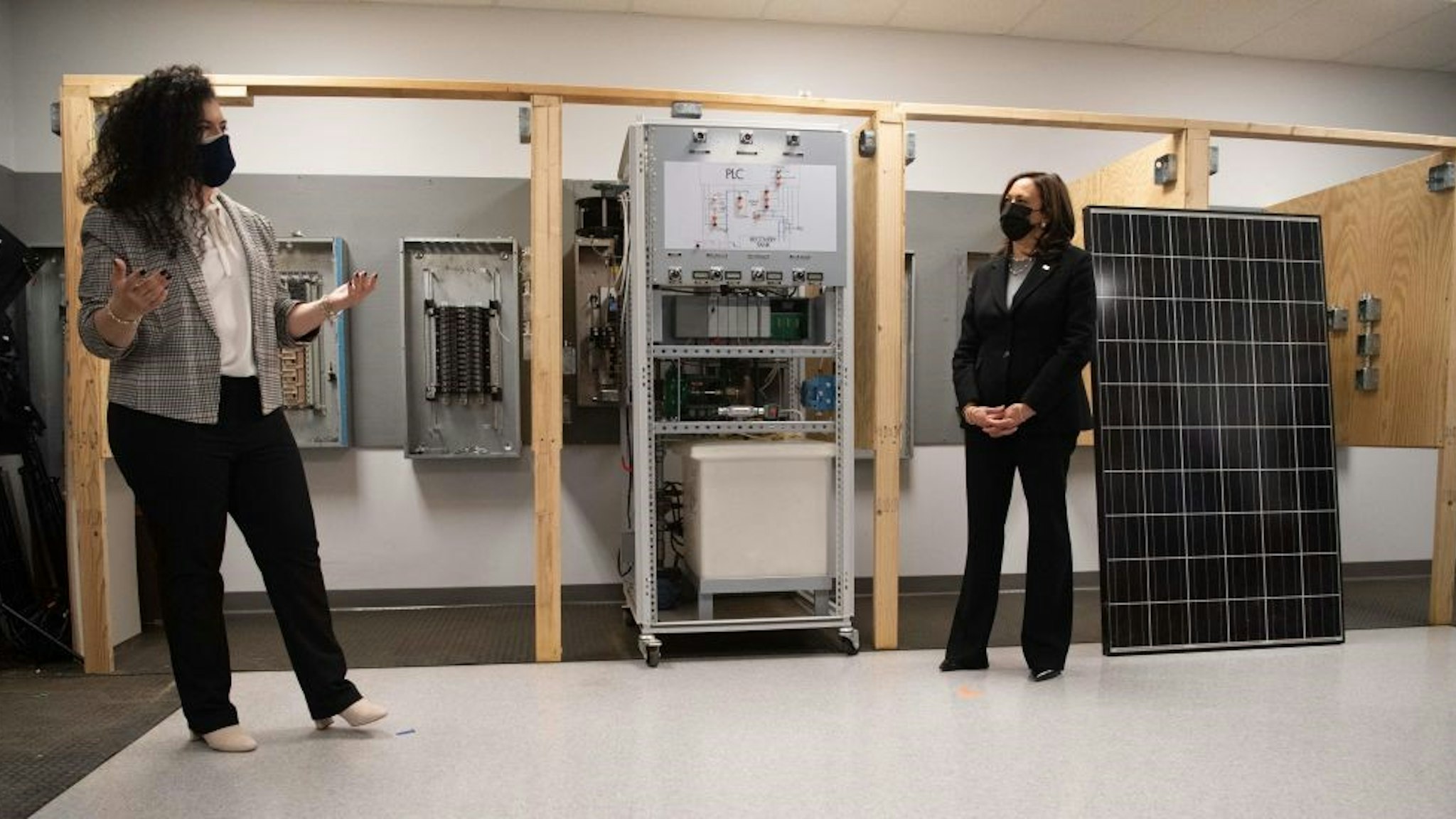 US Vice President Kamala Harris speaks with Haley Kamberalis, IBEW apprentice, as she tours the IBEW Training Center in Concord, New Hampshire, April 23, 2021 as she travels to the state to promote the administration's economic plans. (Photo by SAUL LOEB / AFP) (Photo by