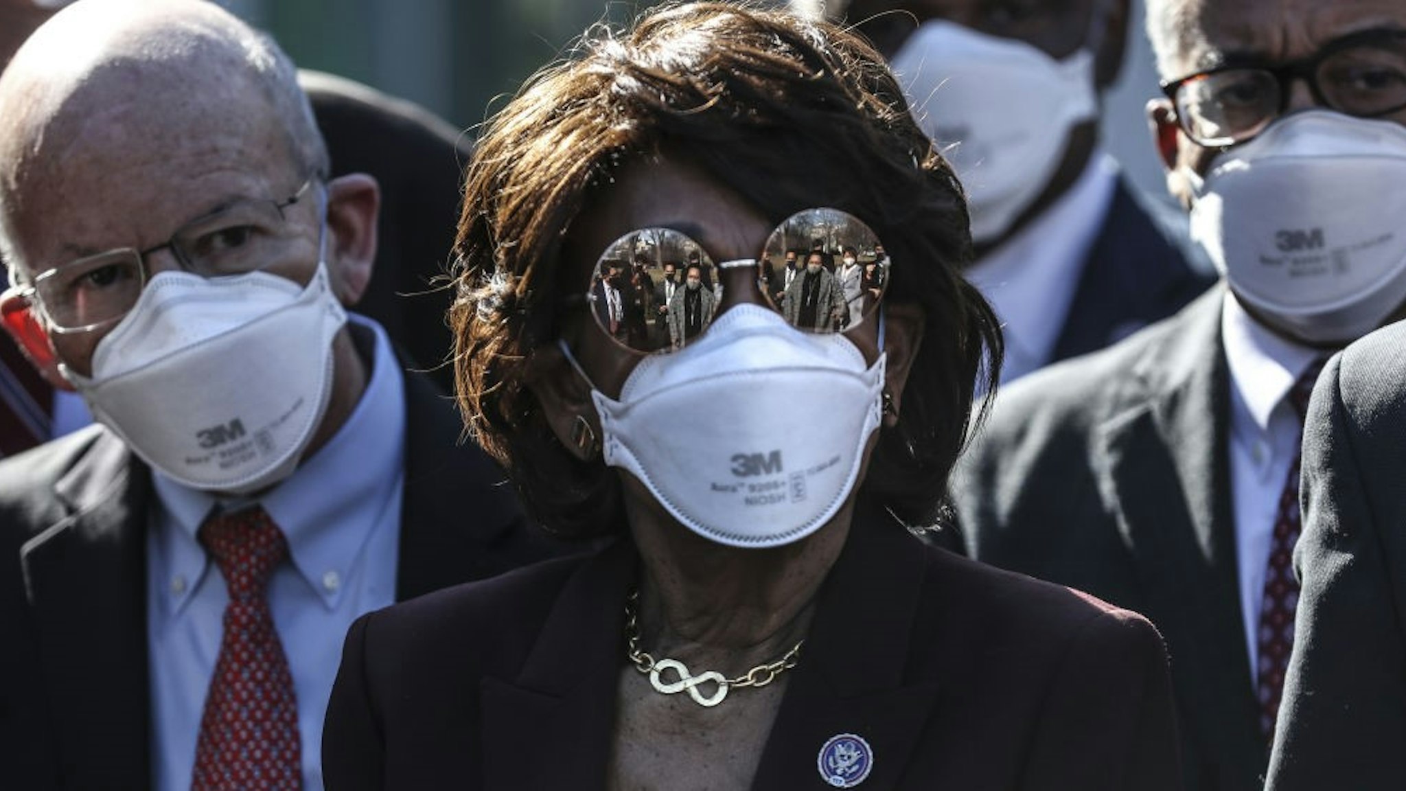 Representative Maxine Waters, a Democrat from California, wears sunglasses and a protective mask during a press conference outside the White House following a meeting with U.S. President Joe Biden in Washington, D.C., U.S., on Friday, Feb. 5, 2021. The Senate voted 51-50 to adopt a budget blueprint for Biden's $1.9 trillion virus relief package following nearly 15 hours of wading through amendments from both parties. Photographer: