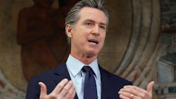 0C627571-5DFD-4763-A6A7-5B9E04B78061_1_201_a OAKLAND, CALIFORNIA - MAY 10: California Gov. Gavin Newsom speaks during a press conference at The Unity Council on May 10, 2021 in Oakland, California. California Gov. Gavin Newsom announced a $100 billion economic recovery package for the state that would include a new round of $600 stimulus checks for low-income residents making up to $75,000 a year. An estimated two out of three Californians would receive the check and families with children would receive an additional $500. Newsom also announced a projected $75.7 billion budget surplus compared to last year's projected $54.3 billion shortfall. (Photo by Justin Sullivan/Getty Images)