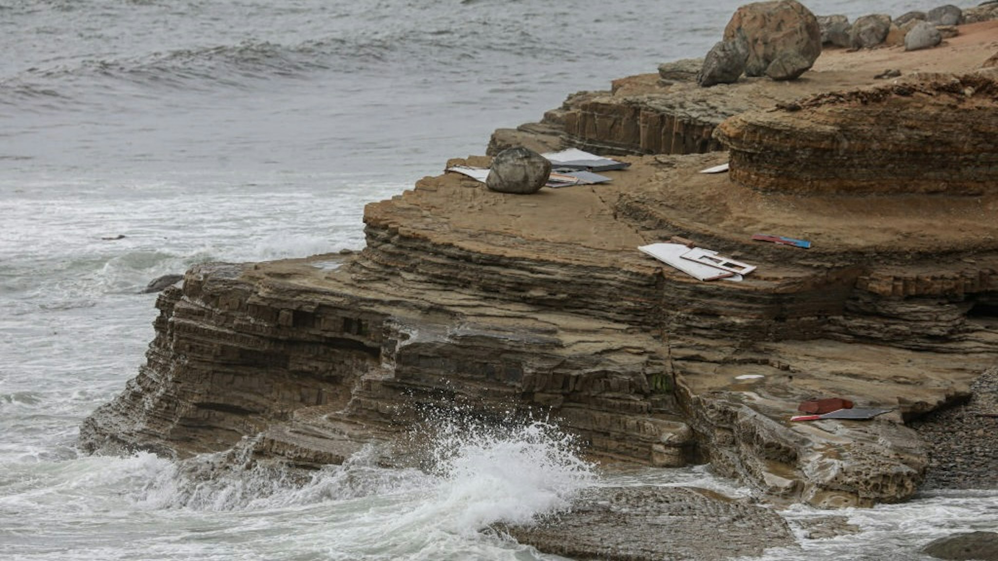 SAN DIEGO, CA - MAY 02: Debris is littered along the shoreline off Cabrillo Monument on May 2, 2021 in San Diego, California. Two people died and Twenty were rescued after a vessel overturned on Sunday afternoon off Point Loma area of San Diego(Photo by Sandy Huffaker/Getty Images)