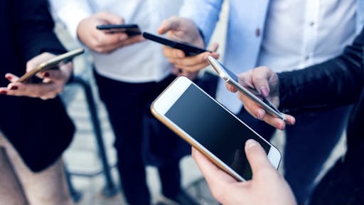Sharing your details has never been easier Corporate business networking - stock photo Sharing your details has never been easier bluecinema via Getty Images
