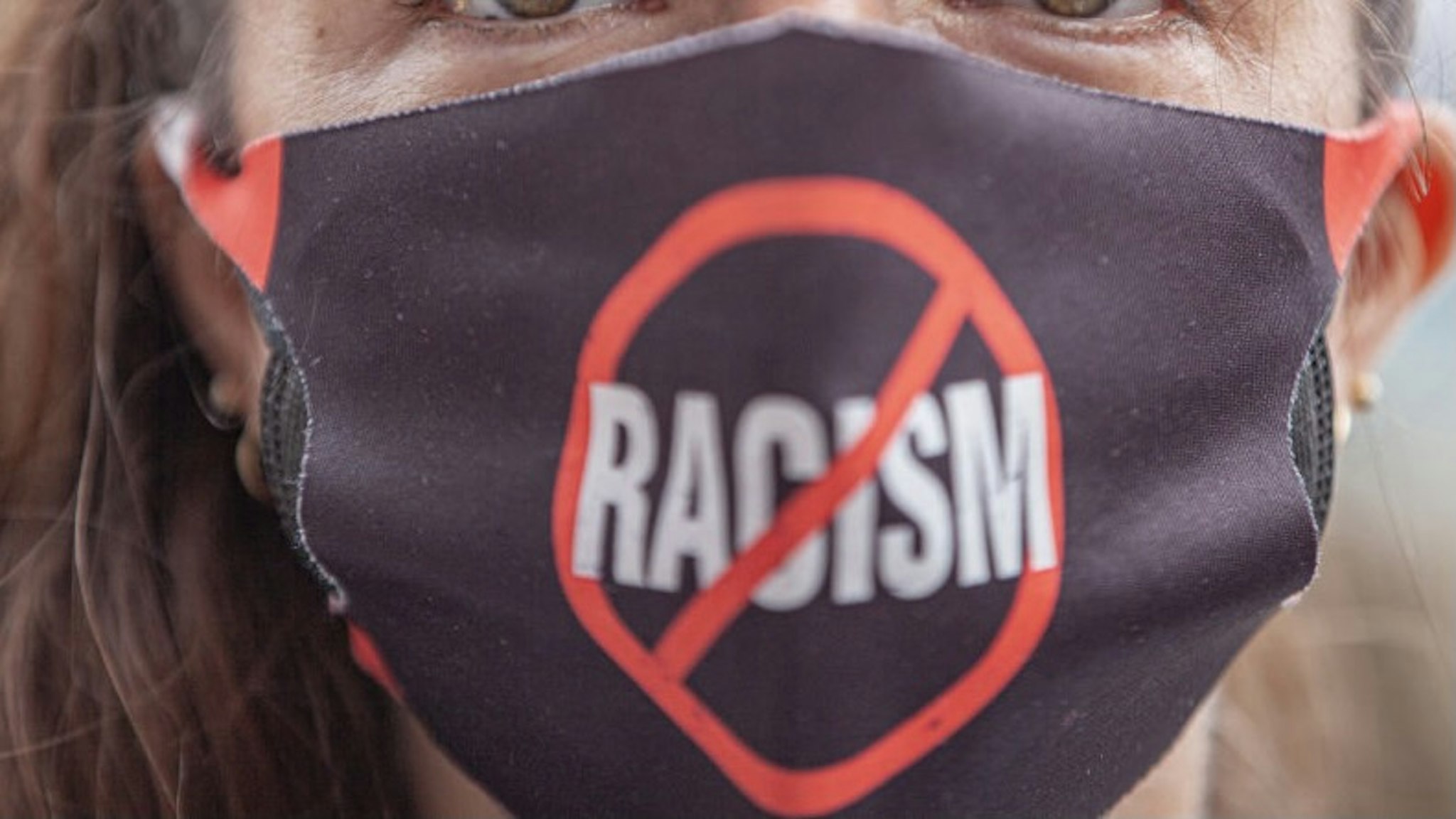 COLUMBUS, OH - APRIL 17: A Black Lives Matter activist wears an anti-racism facial covering at a protest against police brutality in front of the Ohio Statehouse on April 17, 2021 in Columbus, Ohio. Demonstrators gathered in response to multiple recent officer-involved shootings in the U.S. including Miles Jackson, 27, who was fatally shot by Columbus Police in Mount Carmel St. Anns Hospital in Westerville, Ohio on April 12. (Photo by Stephen Zenner/Getty Images)