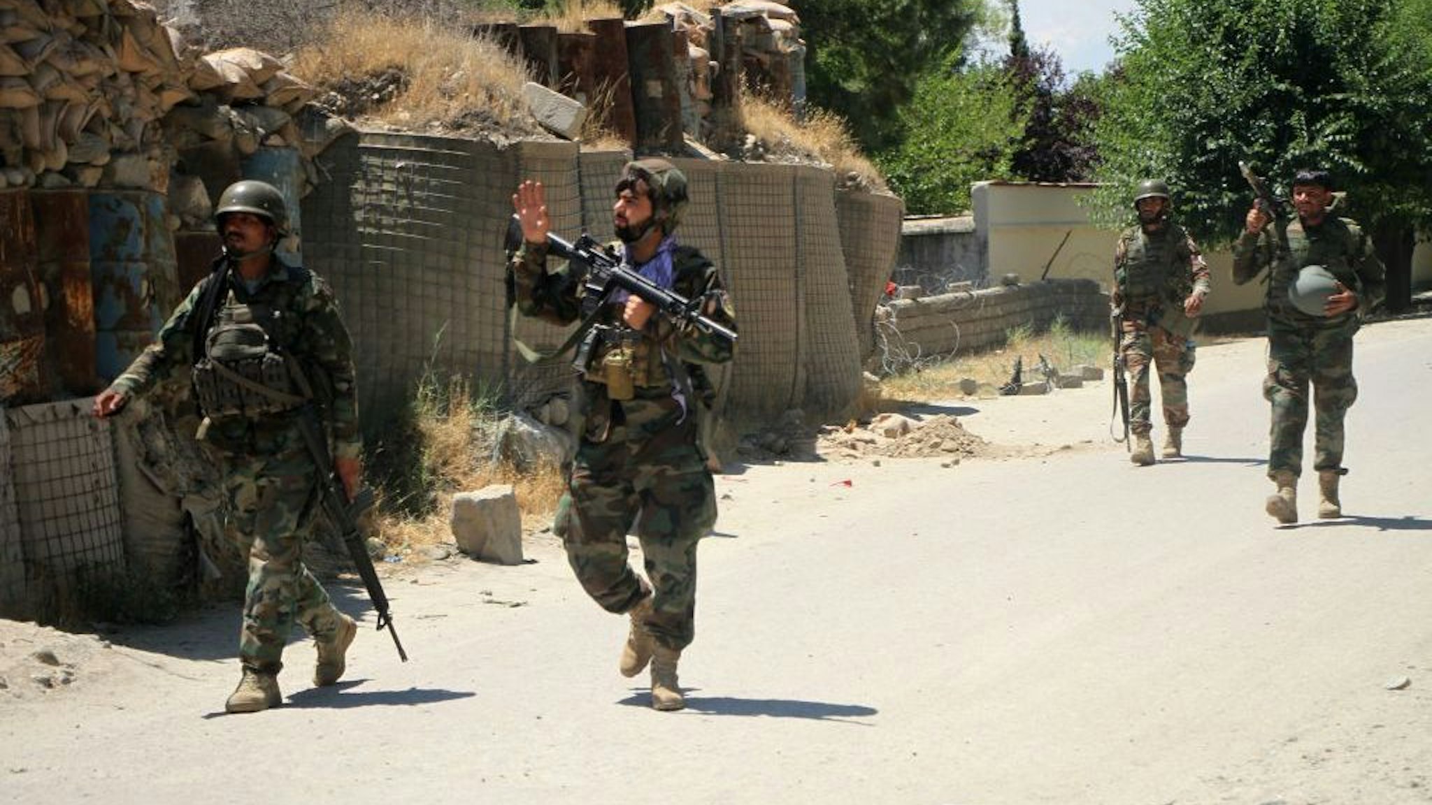 Afghan army soldiers take part in a military operation against Taliban militants in Mehterlam, Laghman province, Afghanistan, on May 24, 2021. Taliban militants have seized three districts over the past weeks amid increasing militancy and counter-militancy in war-torn Afghanistan, local media reported. In its latest attempt to gain ground, the Taliban militants overrun Jalriz district in eastern Wardak province and Dawlat Shah district in Laghman province. The Taliban militants also captured Burka district in northern Baghlan province early in May in the wake of fierce fighting. (Photo by Saifurahman Safi/Xinhua via Getty Images)