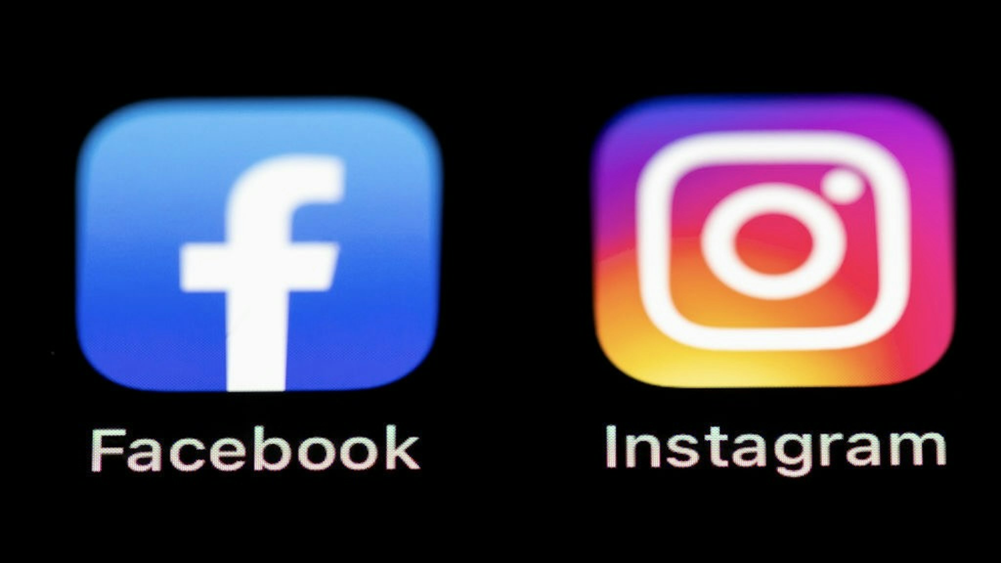 Social Media Apps KIRCHHEIM UNTER TECK, GERMANY - MARCH 09: (BILD ZEITUNG OUT) In this photo illustration, The Facebook and Instagram logos on the screen of an iPhone on March 09, 2021 in Kirchheim unter Teck, Germany. (Photo by Tom Weller/DeFodi Images via Getty Images) DeFodi Images / Contributor via Getty Images