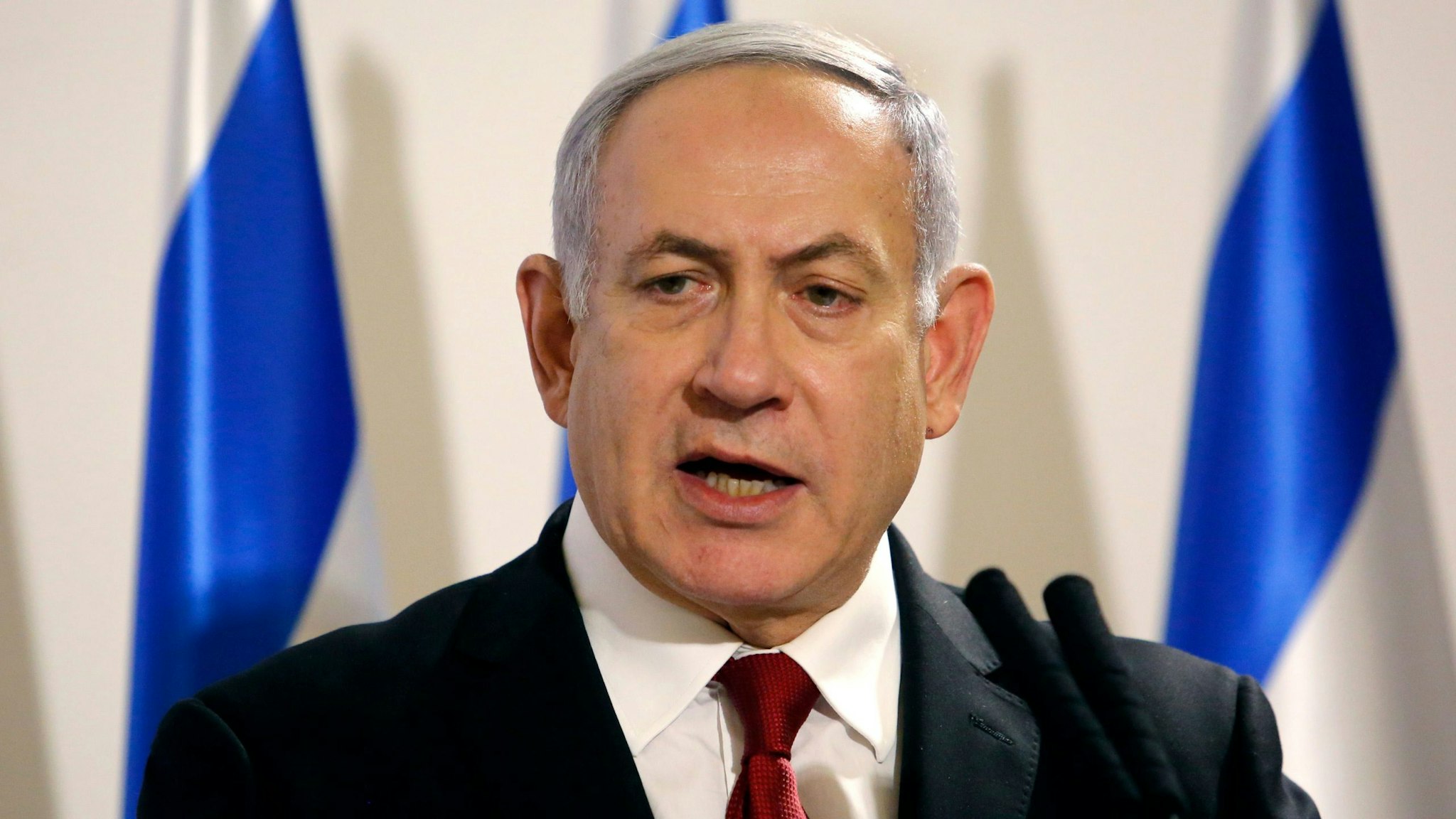 Israeli Prime Minister Benjamin Netanyahu addresses the media at the Defence Ministry in Tel Aviv on November 12, 2019. - Israel's military killed a commander of Palestinian militant group Islamic Jihad in a strike on his home in the Gaza Strip early in the morning, prompting retaliatory rocket fire and fears of a severe escalation in violence.