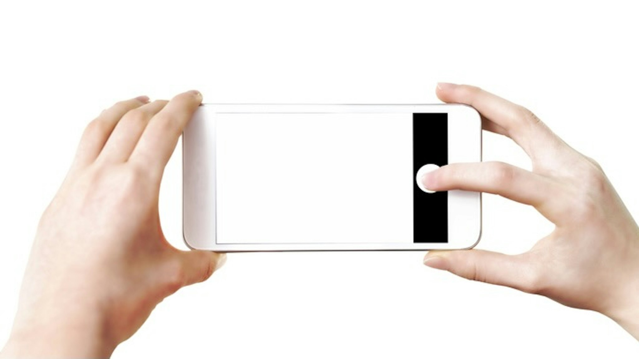 Making photos on smartphone - stock photo Mock-up of making photo on a smartphone - woman's hands holding mobile phone and touching screen isolated on white background WDnet via Getty Images